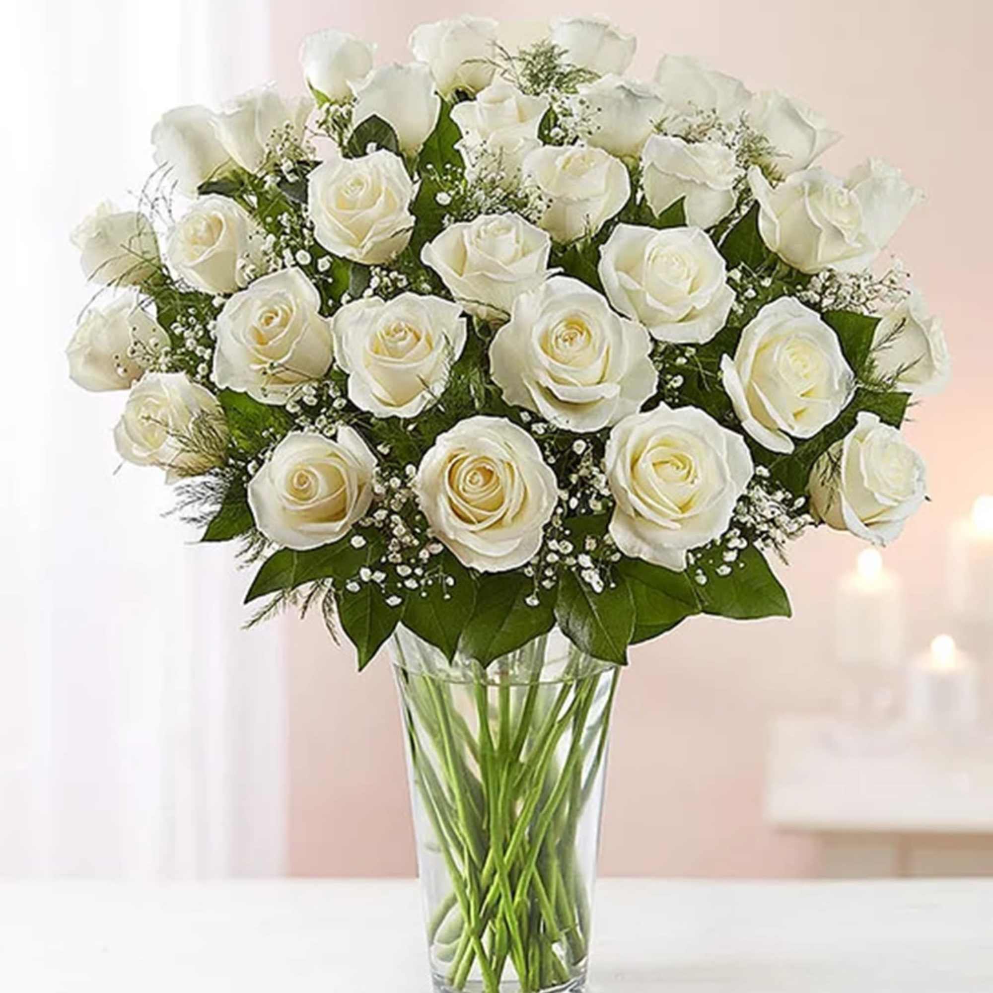 Bouquet of white roses in a clear glass vase