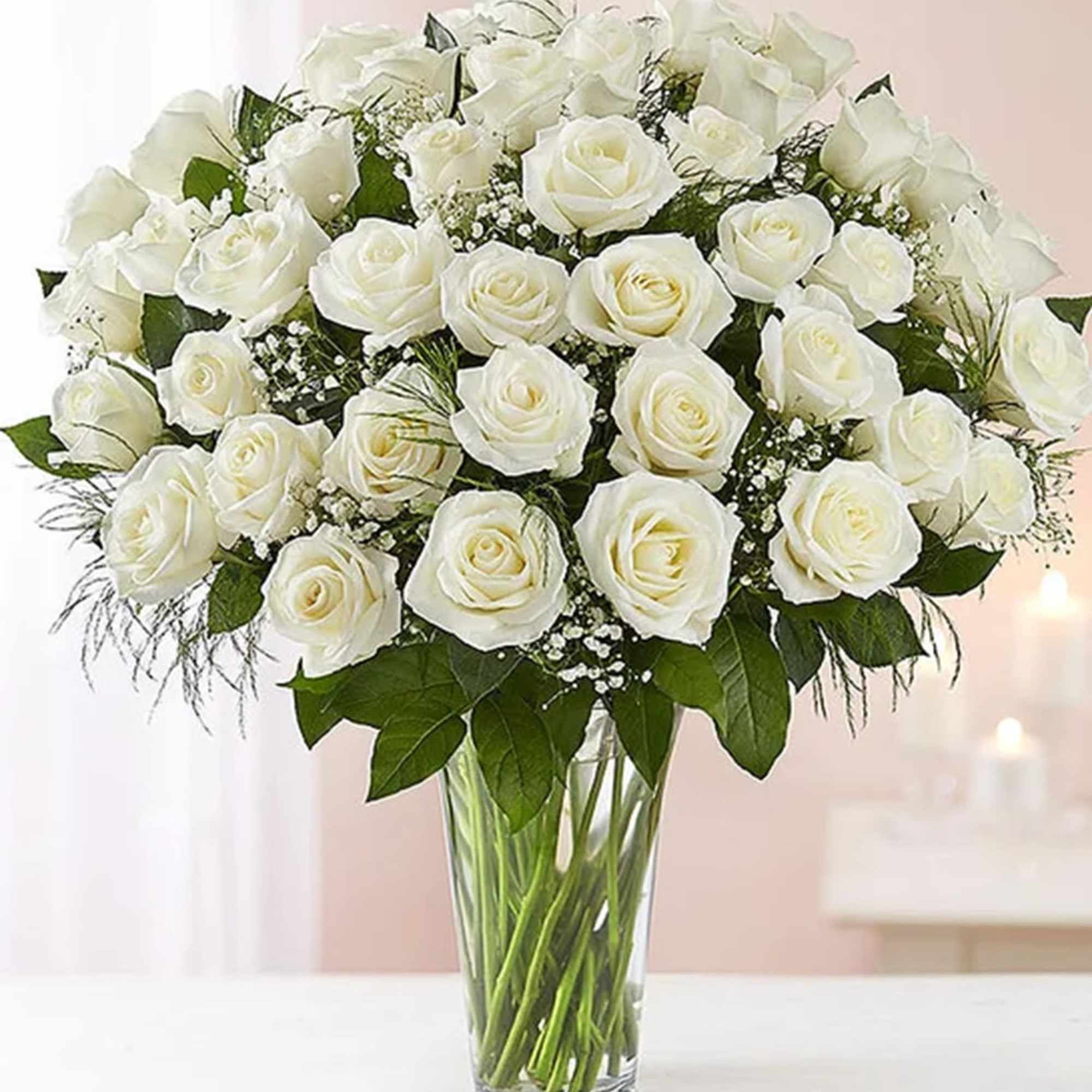 Bouquet of white roses in a clear glass vase