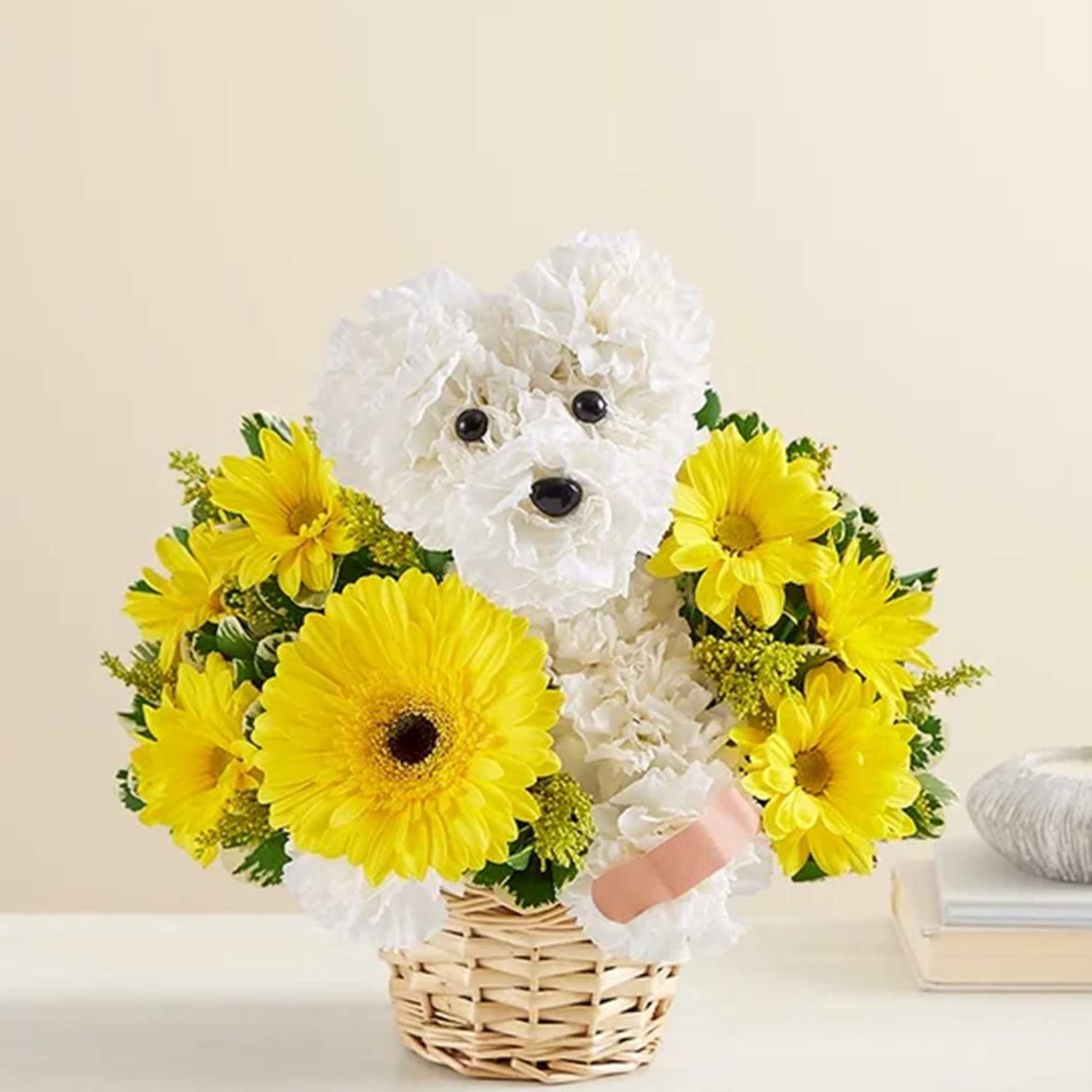 White flower dog in a basket surrounded by yellow daisies