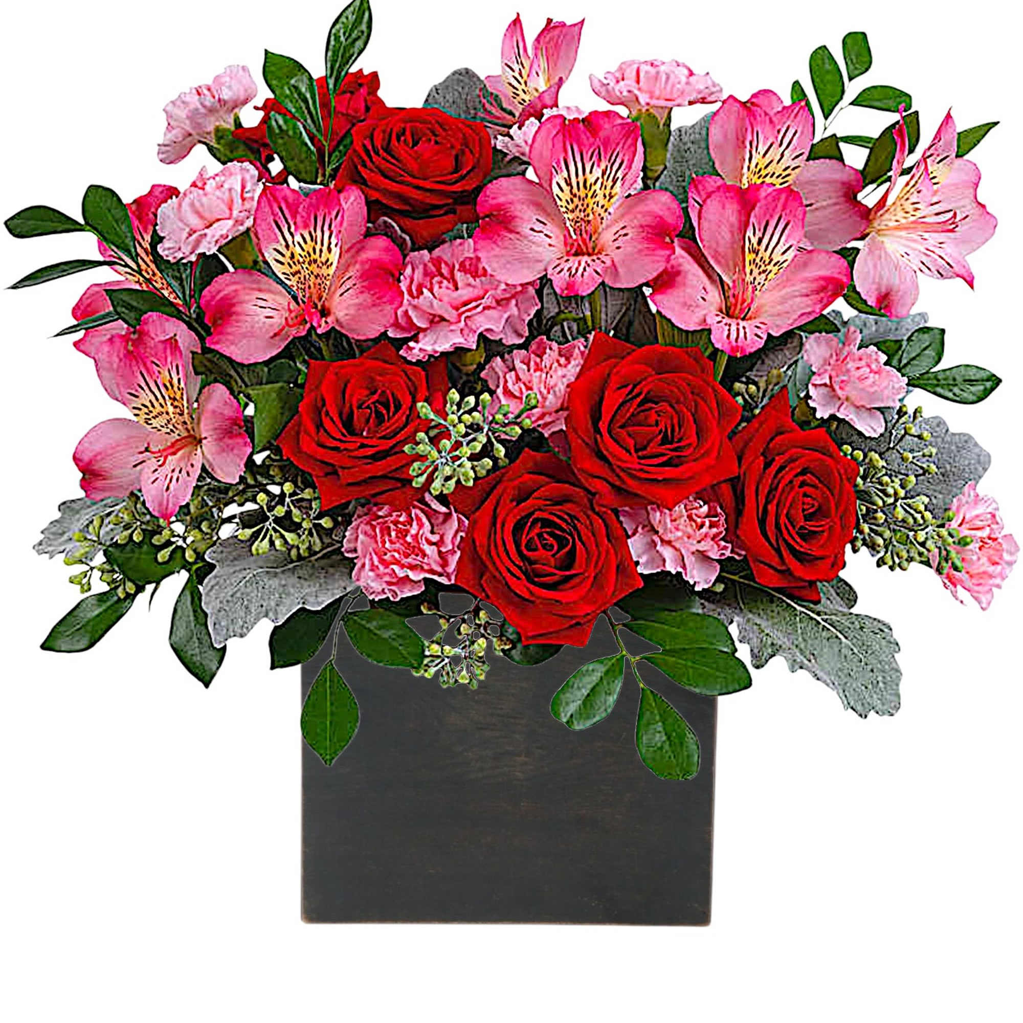 Red roses and pink flowers arranged in a black square vase