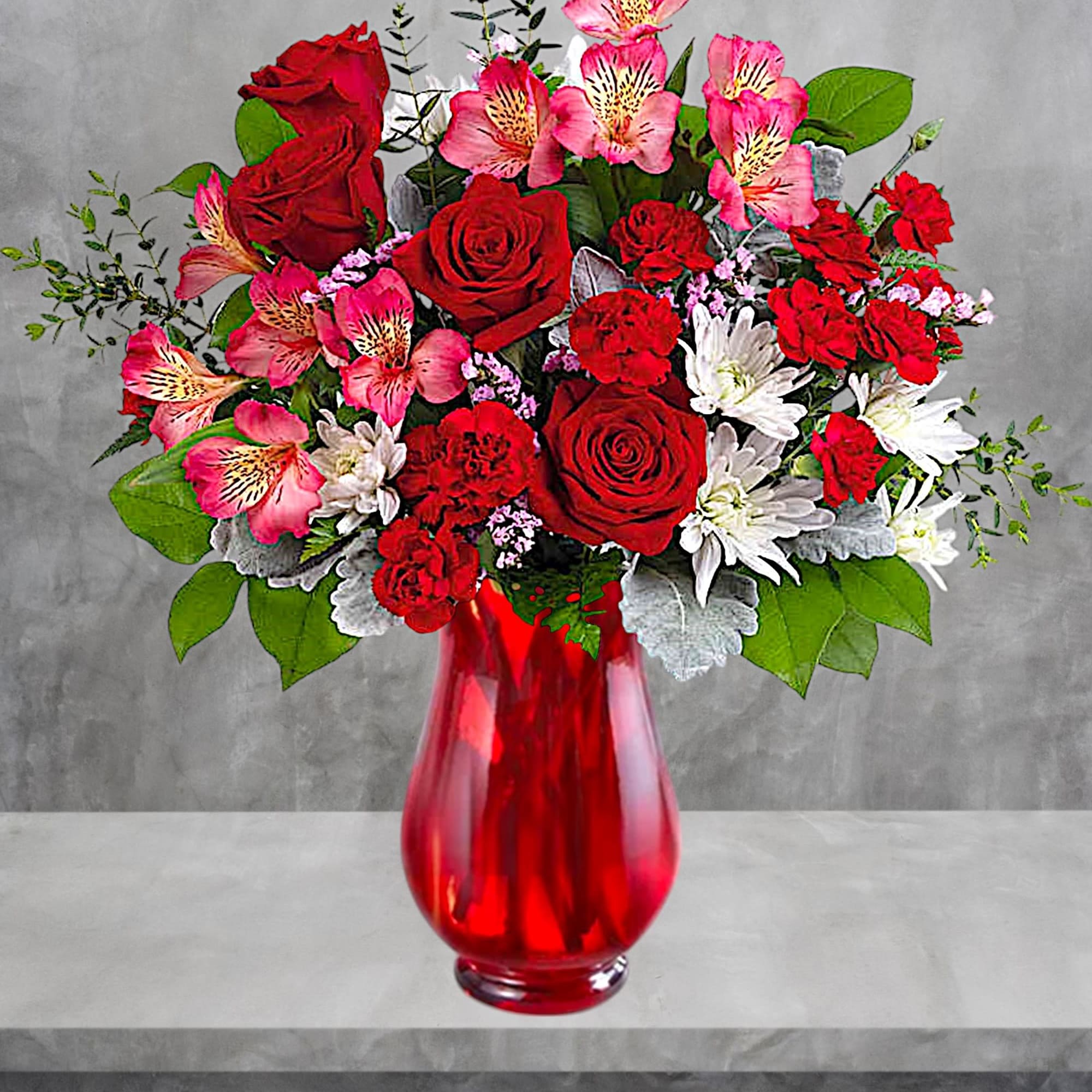 Red roses and pink alstroemeria in a red glass vase, photo 2 of 4