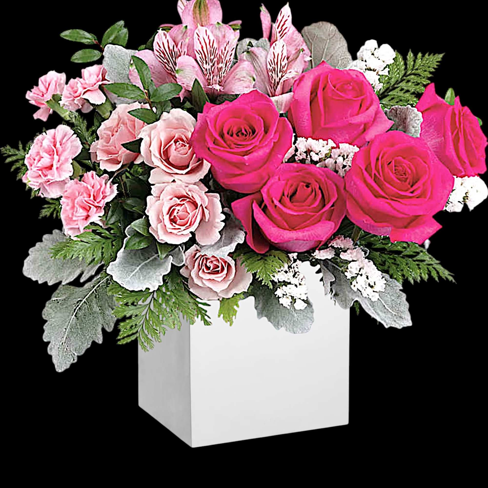 Pink roses and carnations arranged in a white square vase