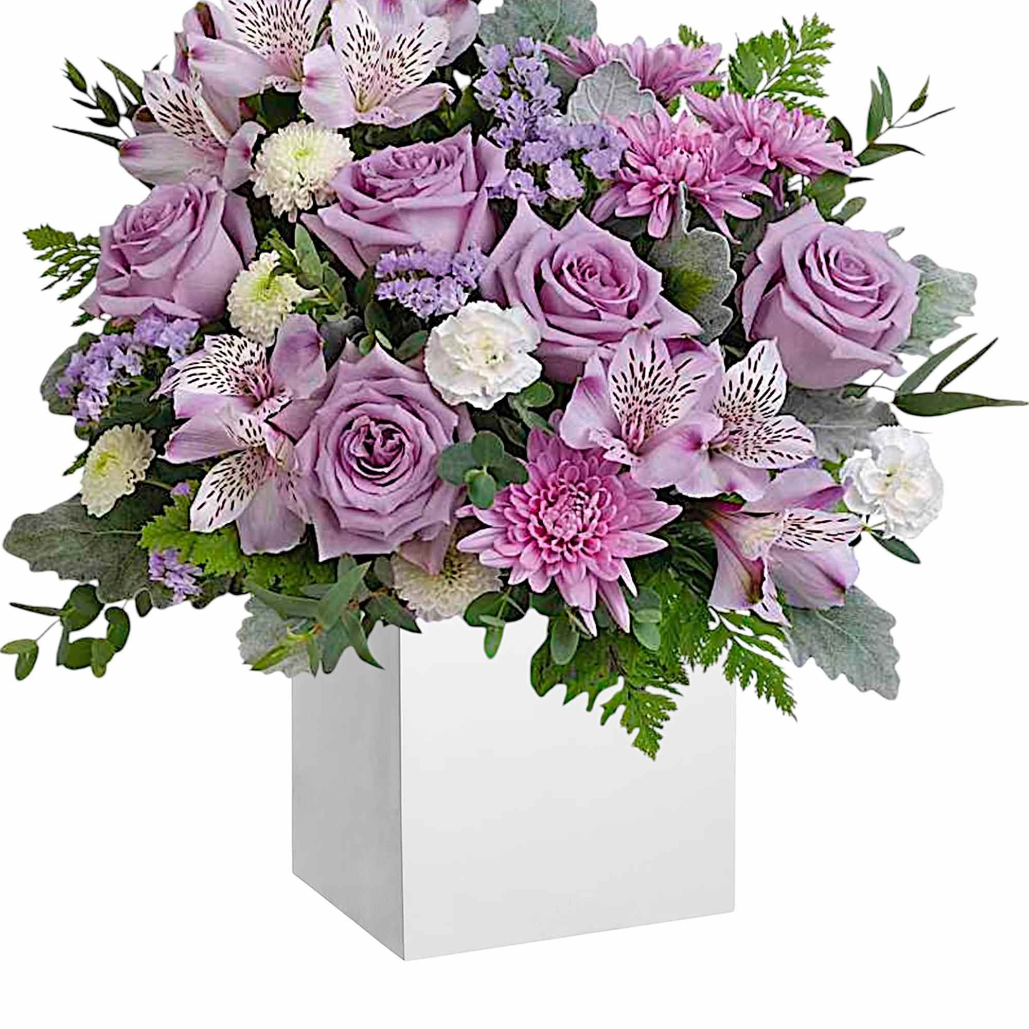 Lavender and pink floral arrangement in a white pedestal vase