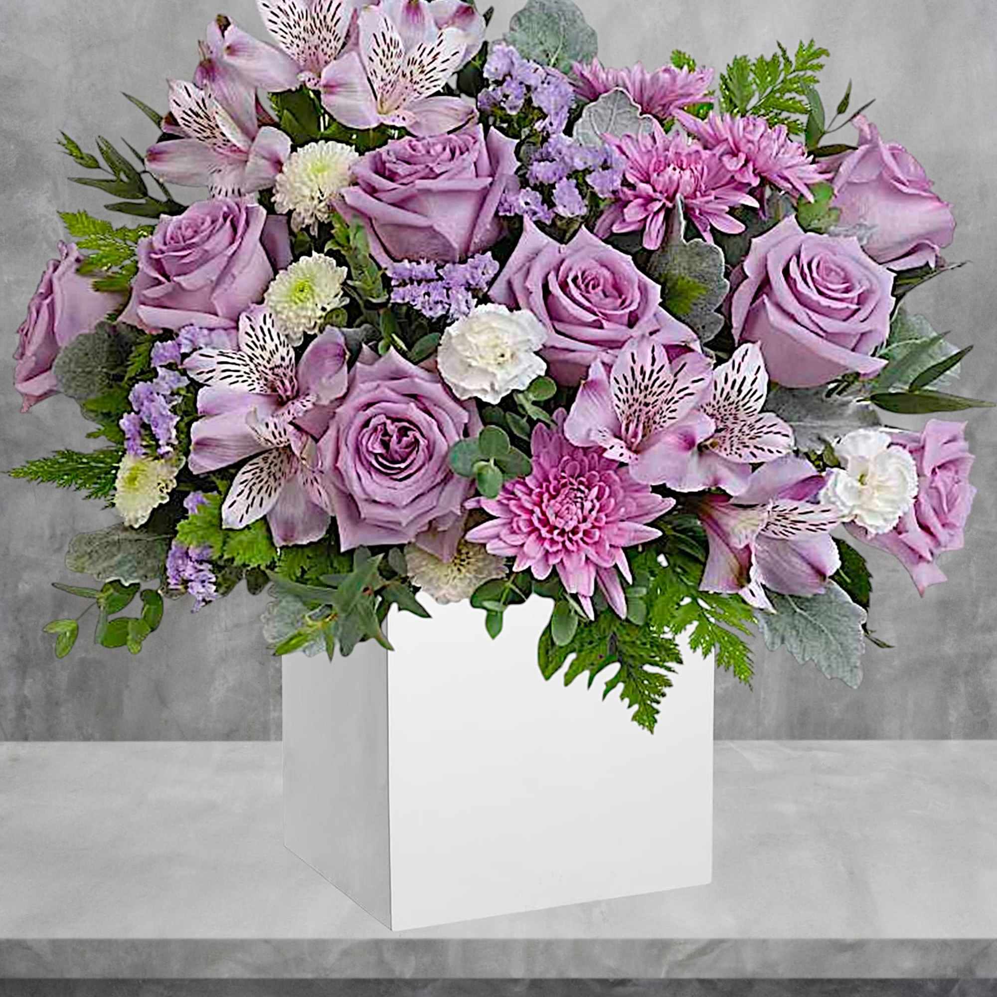 Lavender rose bouquet with pink alstroemeria and chrysanthemums in a white box