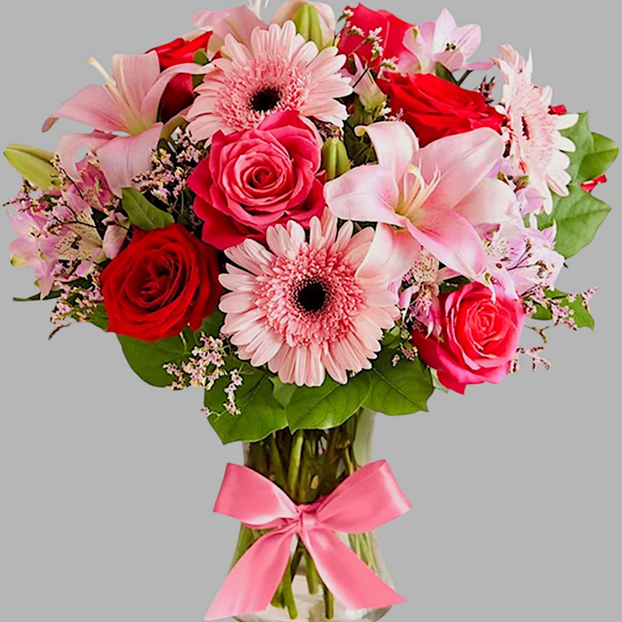 Pink and red mixed bouquet in a glass vase with a pink ribbon, photo 4 of 5
