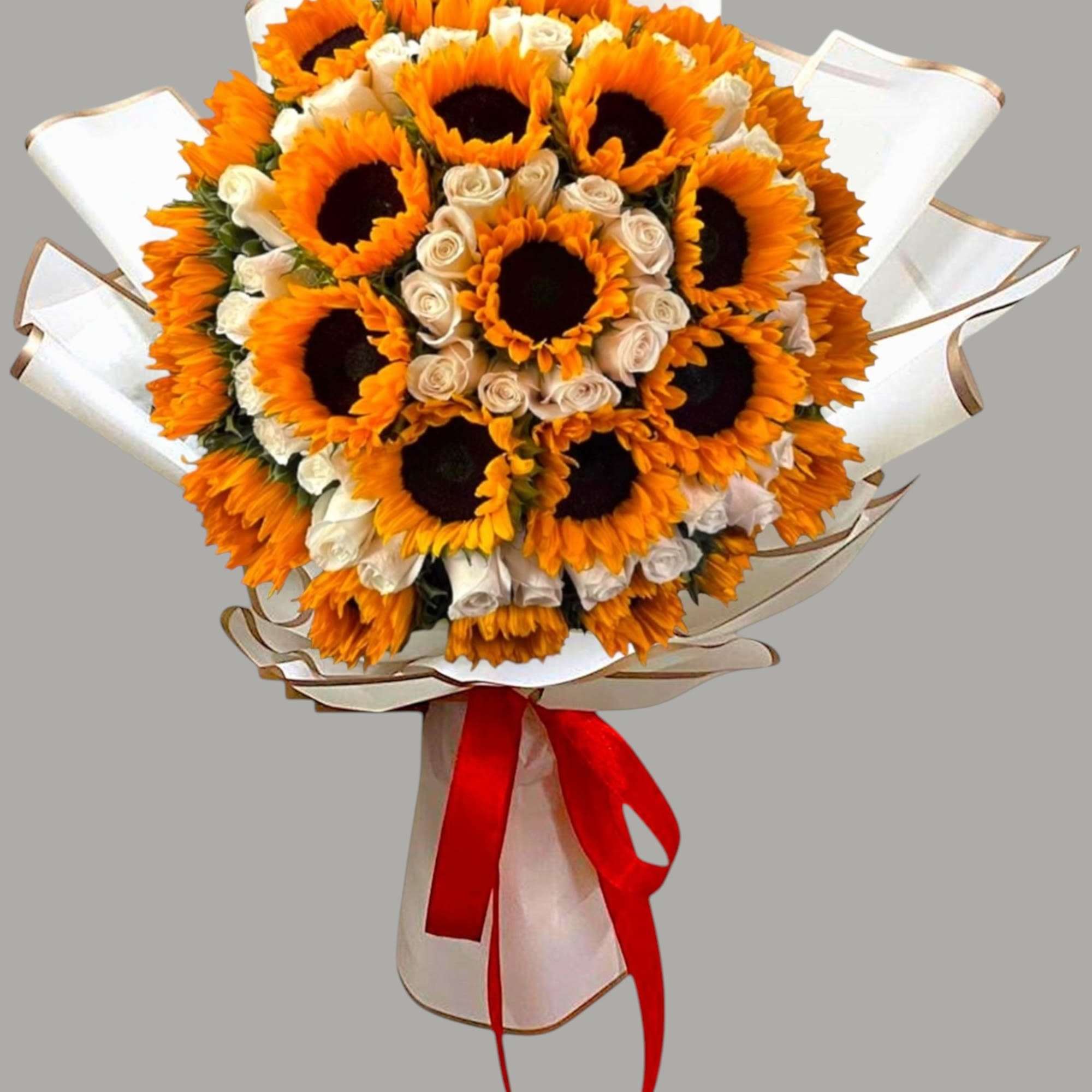 Bouquet of sunflowers and cream roses wrapped in white paper