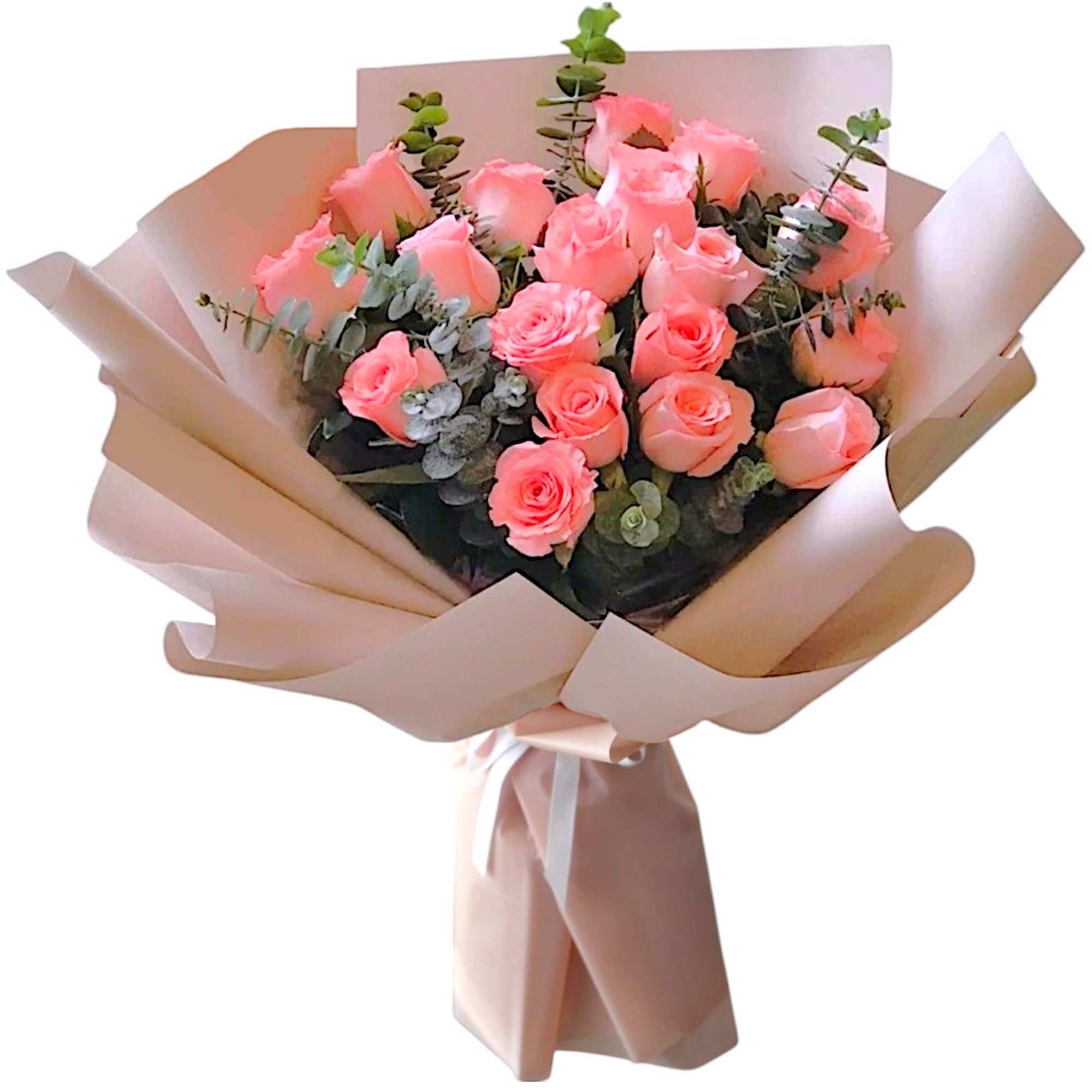 Bouquet of pink roses wrapped in blush paper