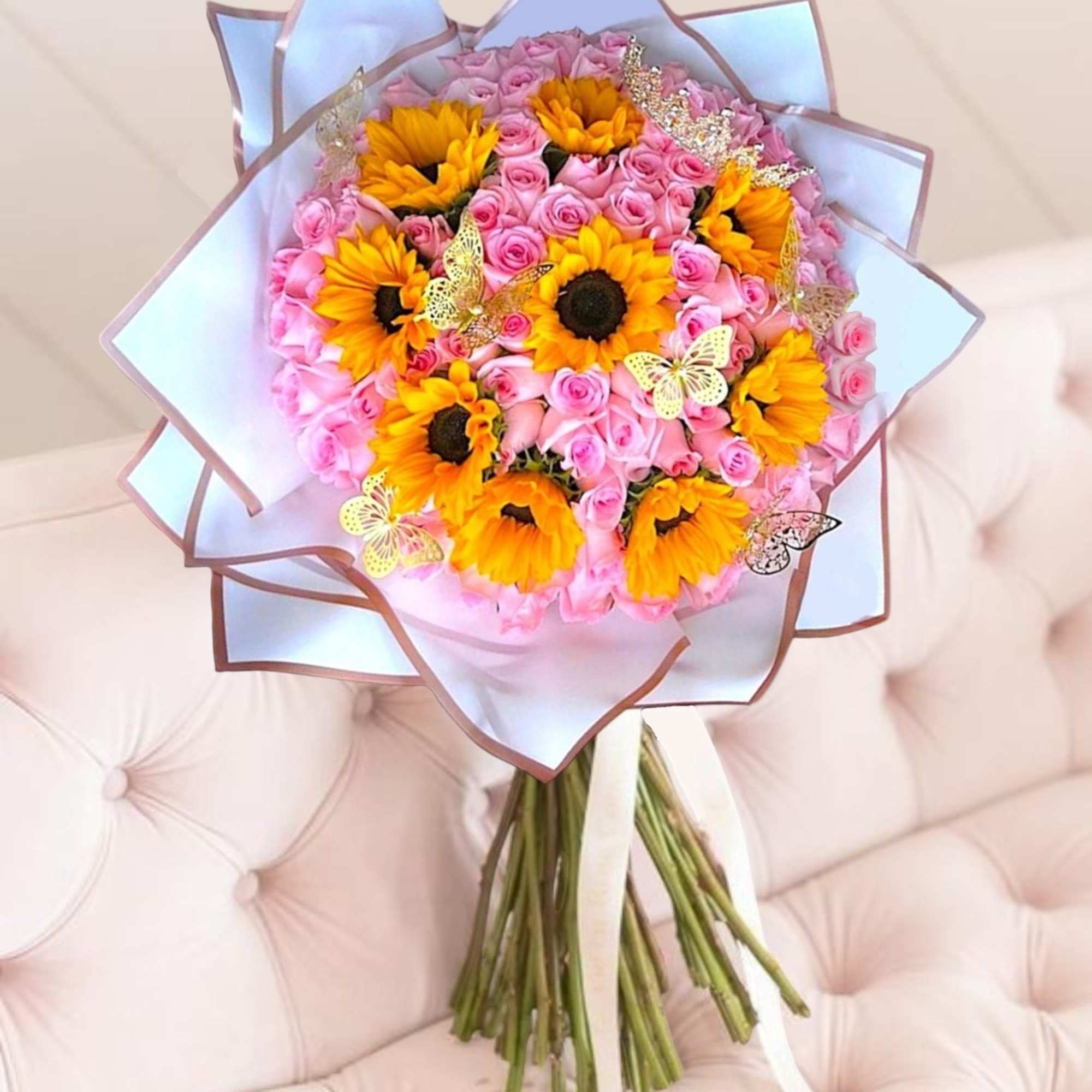 Pink rose bouquet with yellow sunflowers and butterfly accents, photo 2 of 4