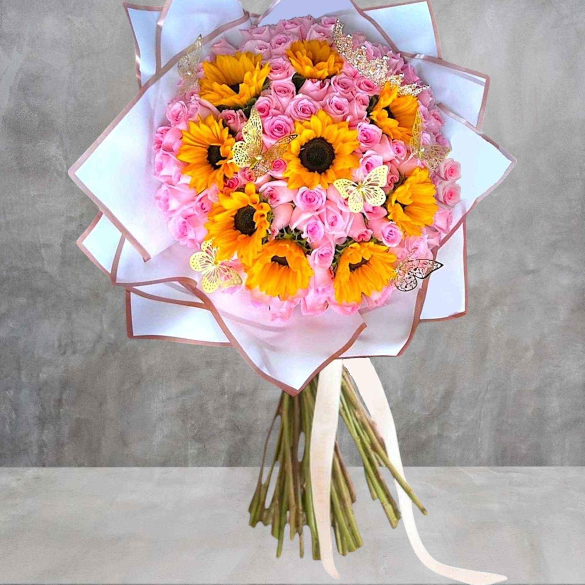 Pink rose bouquet with yellow sunflowers and butterfly accents, photo 3 of 4