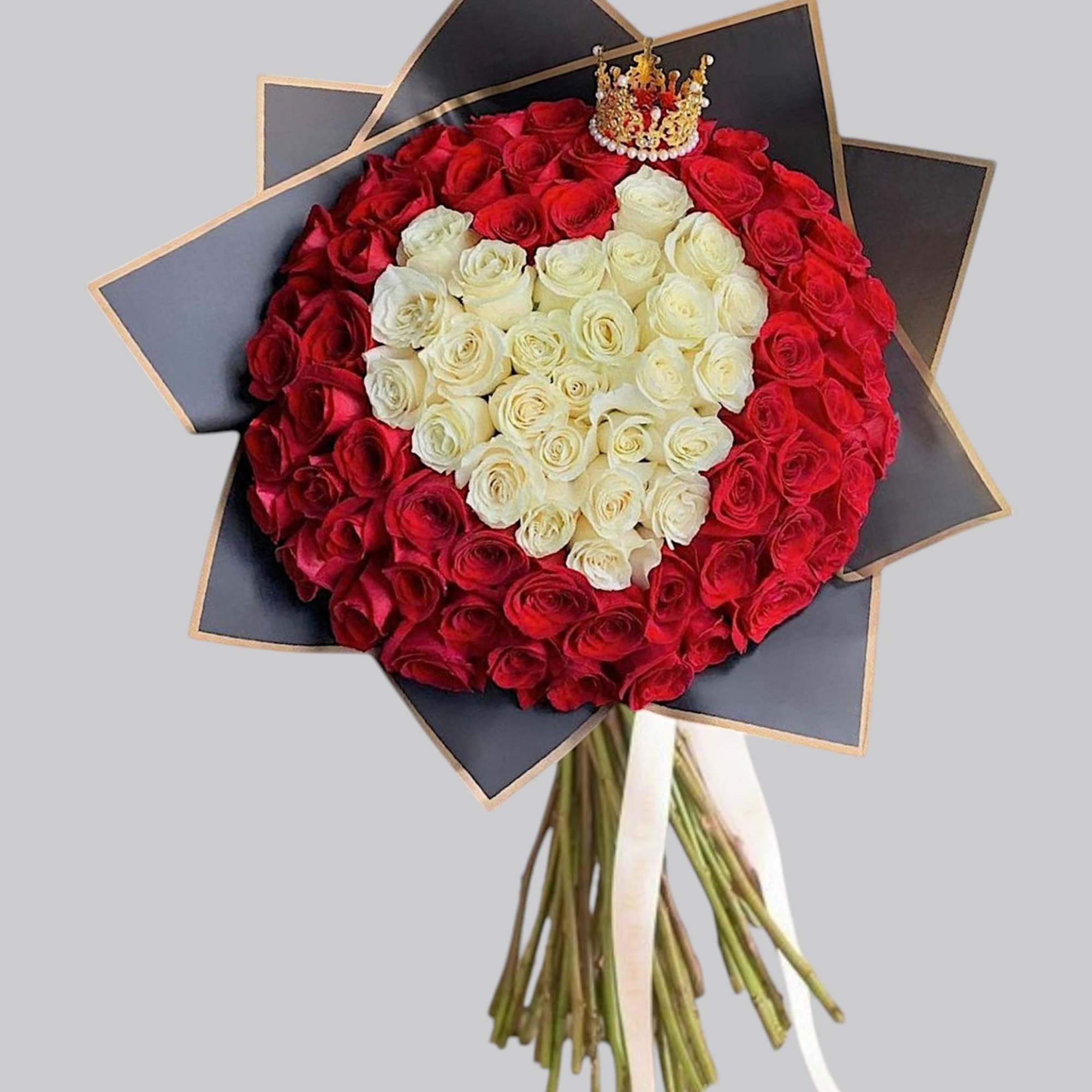 Heart-shaped bouquet of red and white roses with a small crown topper, photo 5 of 5