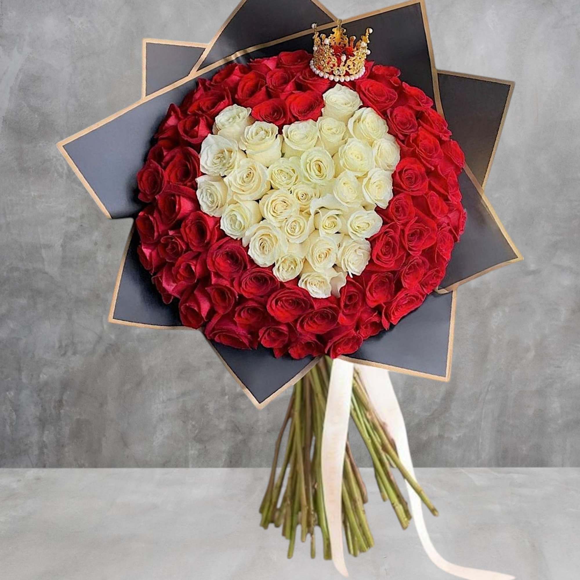 Heart-shaped bouquet of red and white roses with a small crown topper, photo 3 of 5