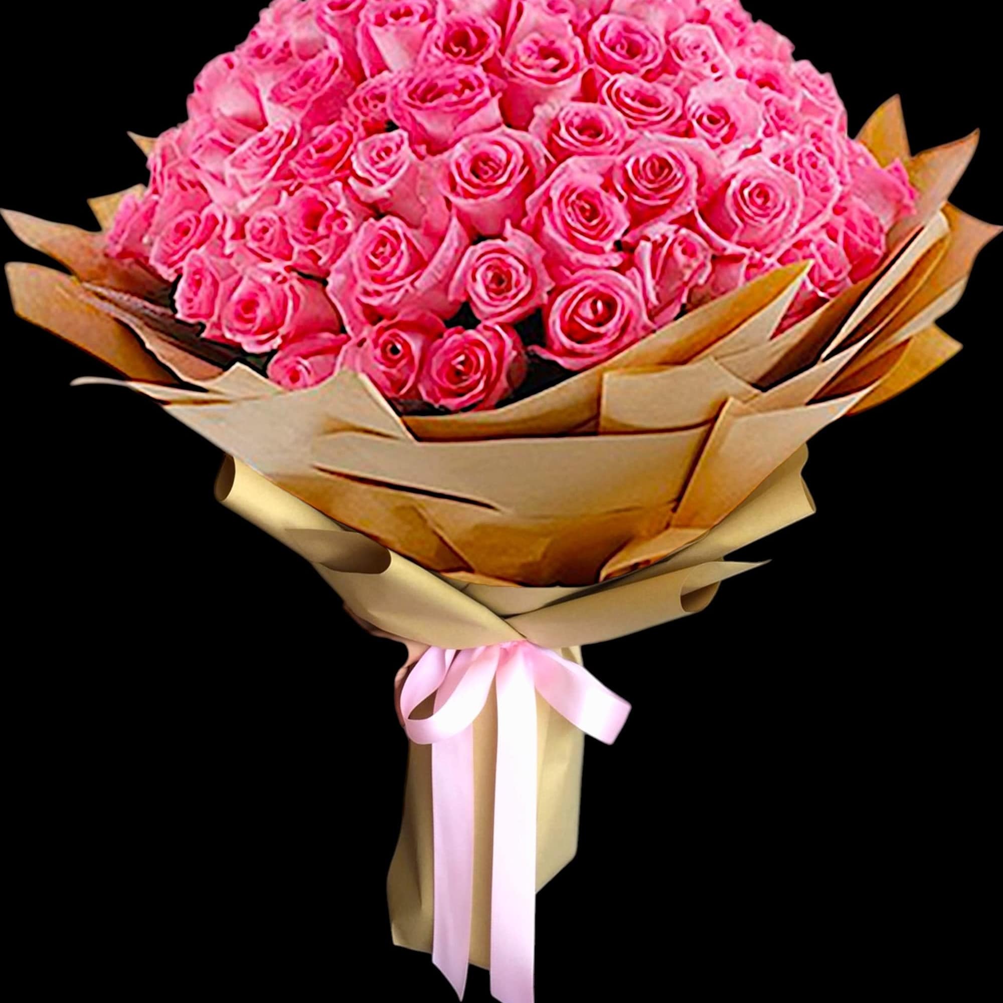Large bouquet of pink roses wrapped in tan paper with a pink ribbon