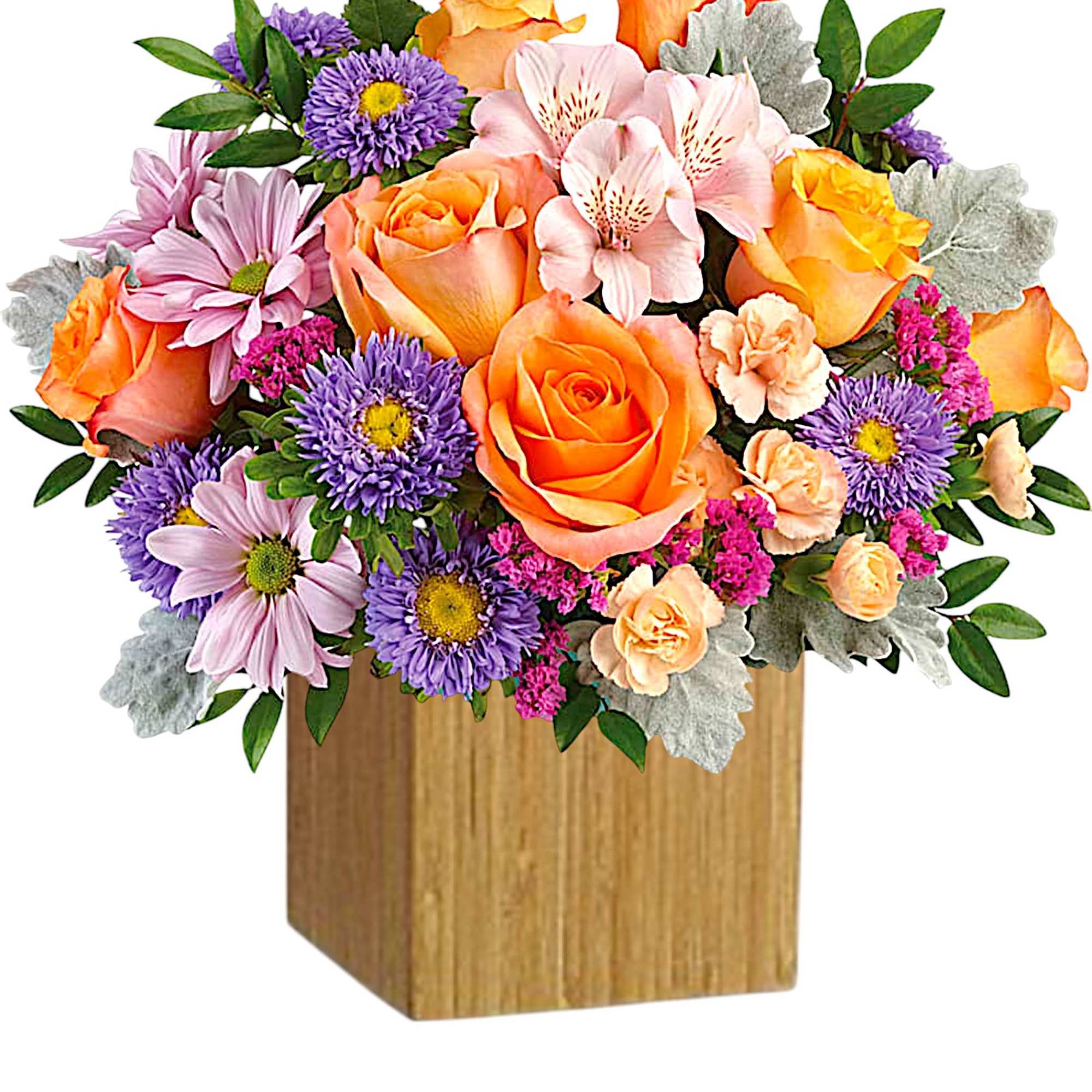 Mixed bouquet of orange roses, purple daisies, and pink flowers in a wooden box
