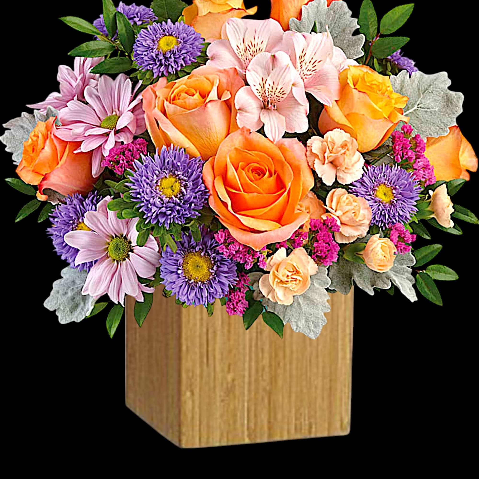 Mixed bouquet of orange roses and purple daisies in a wooden cube vase