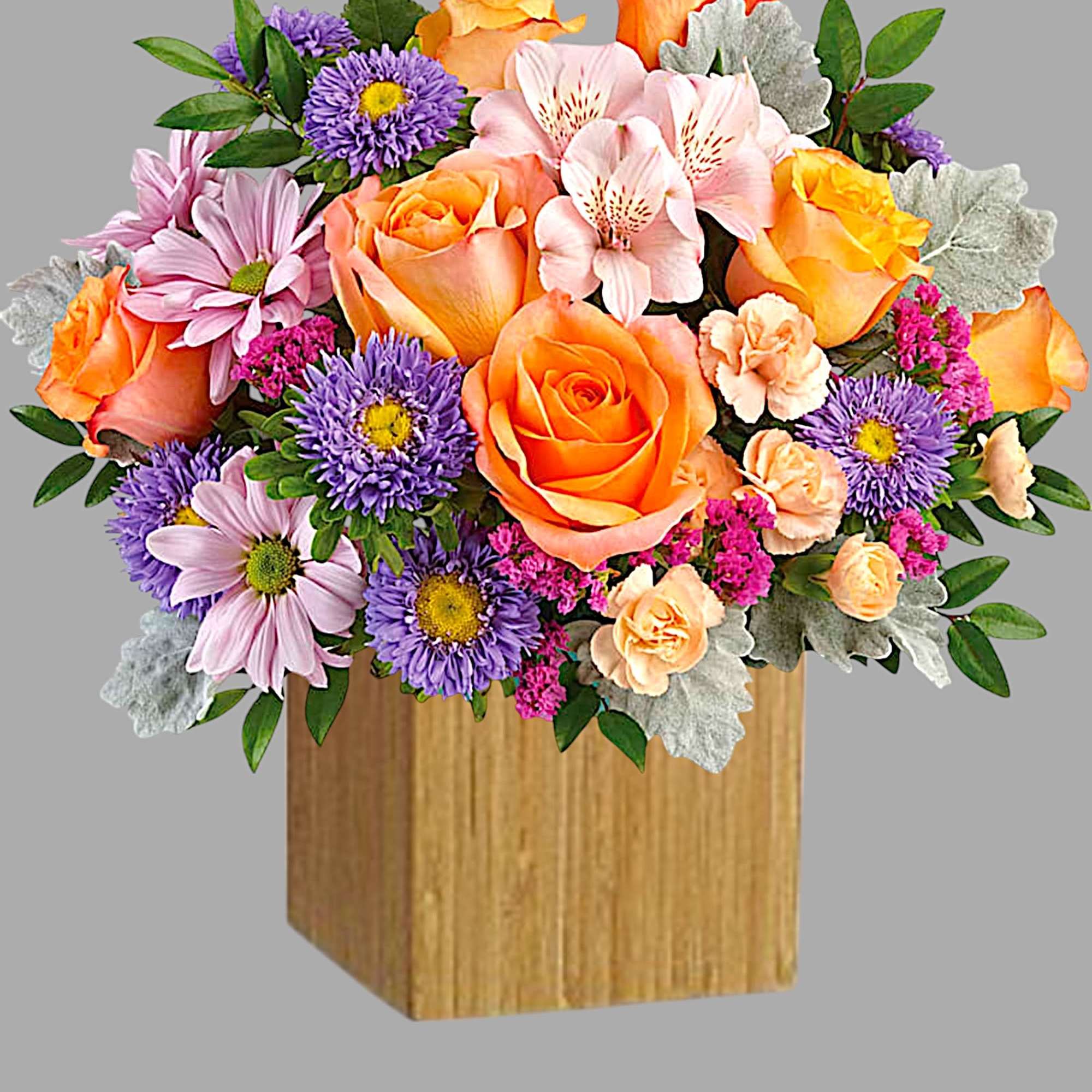 Everyone's abuzz about this beautiful arrangement! Lush orange roses and delicate pink