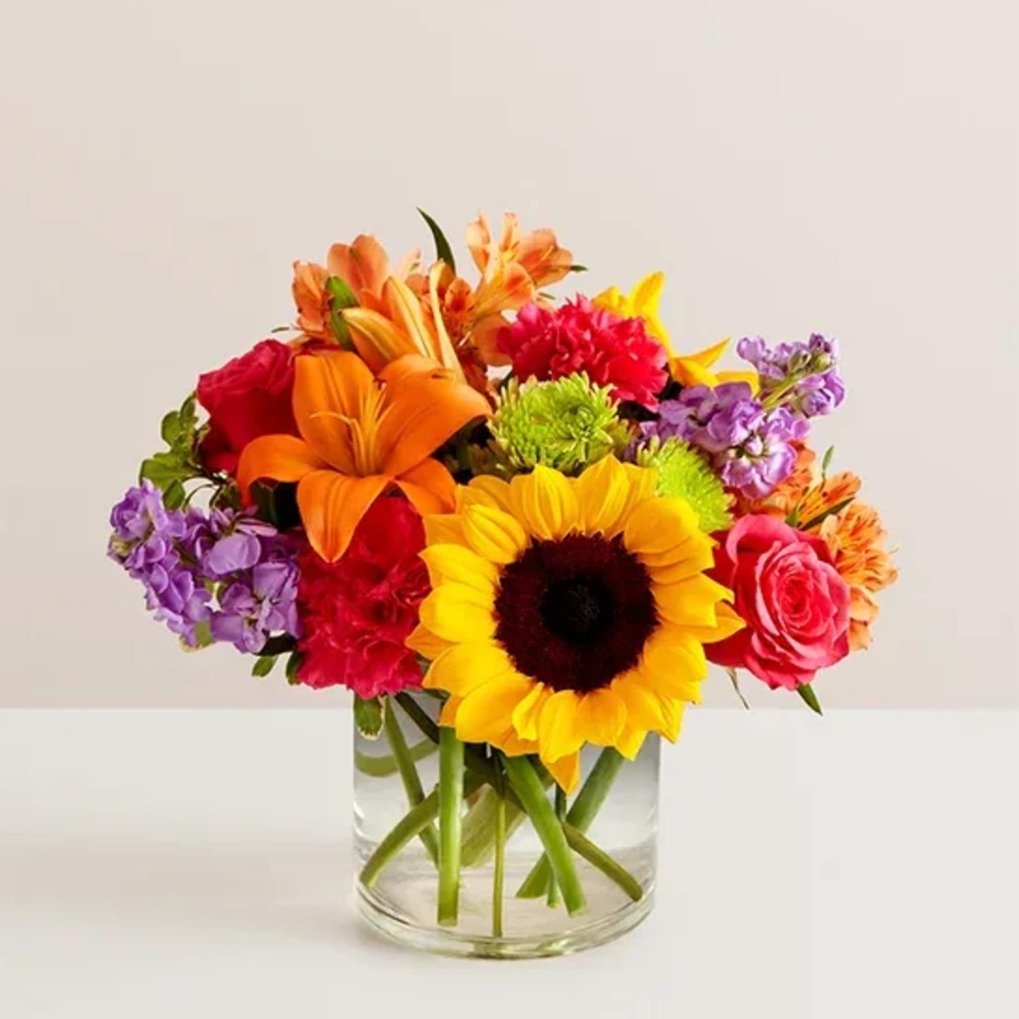 Colorful mixed bouquet in a clear glass vase