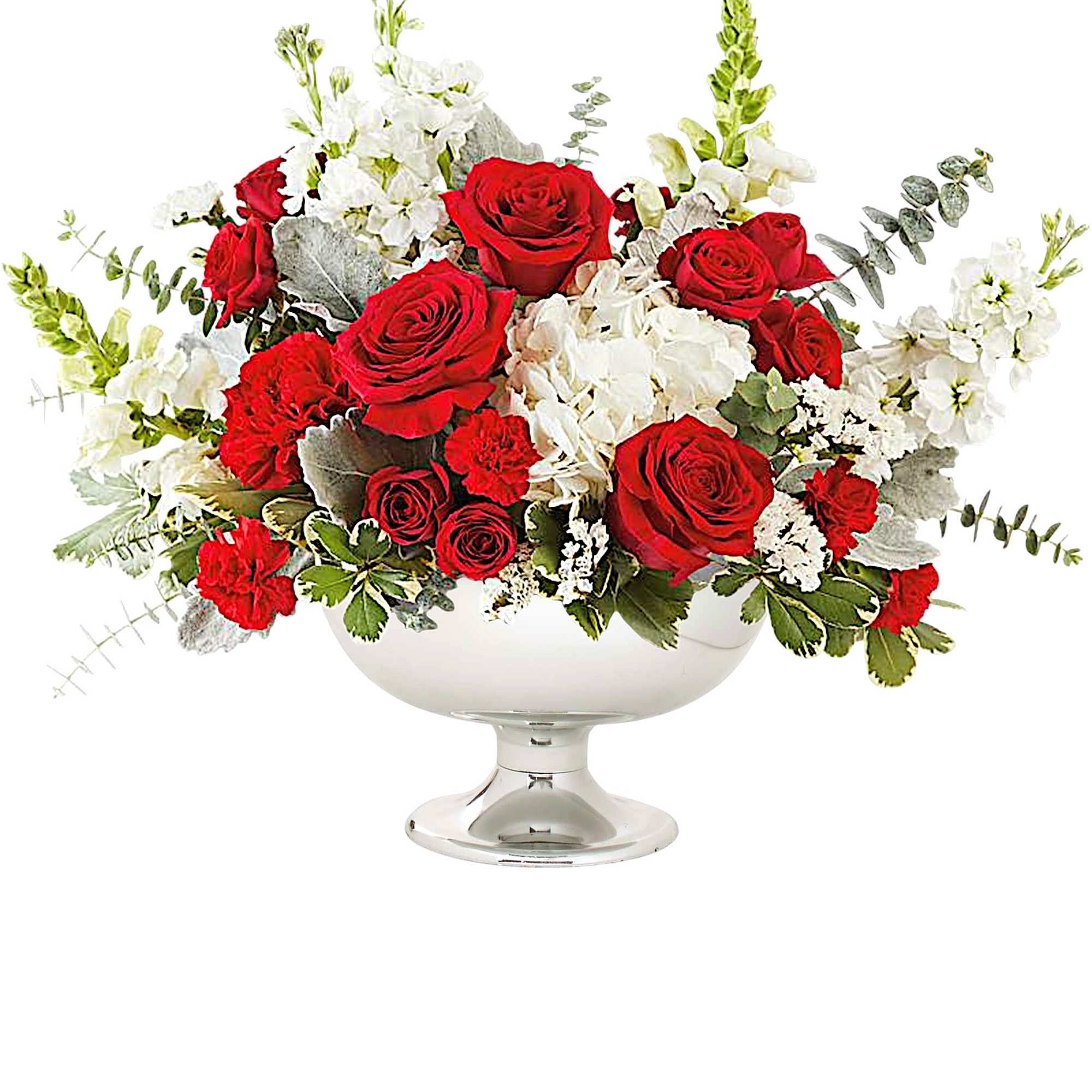 Red roses and white flowers arranged in a silver pedestal bowl