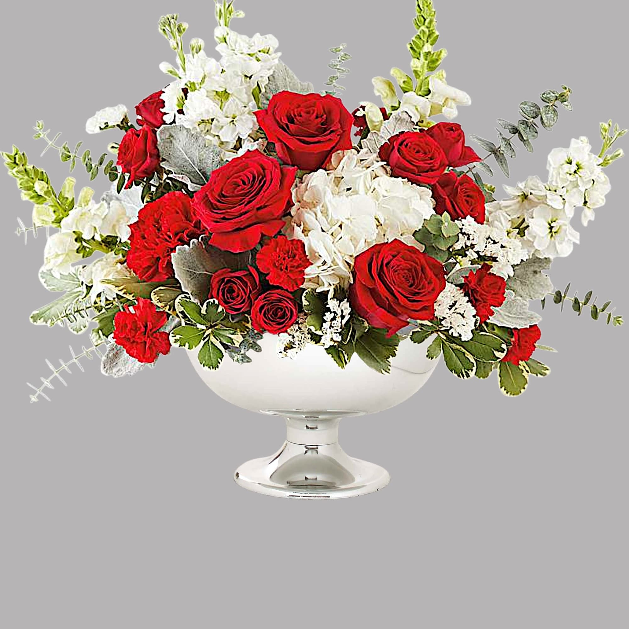 Red roses and white flowers arranged in a white pedestal vase, photo 4 of 4