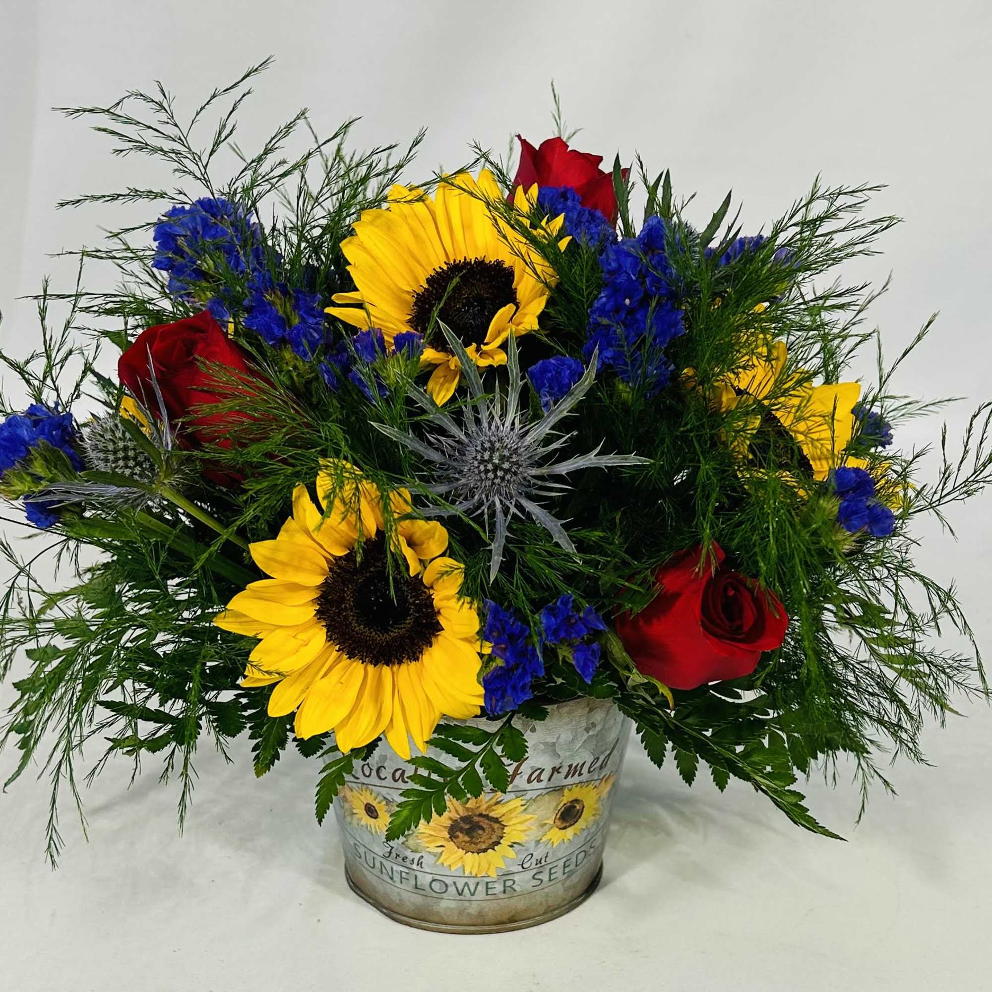 Perfect sunflower and red rose arrangement for any occasion. This cute arrangement