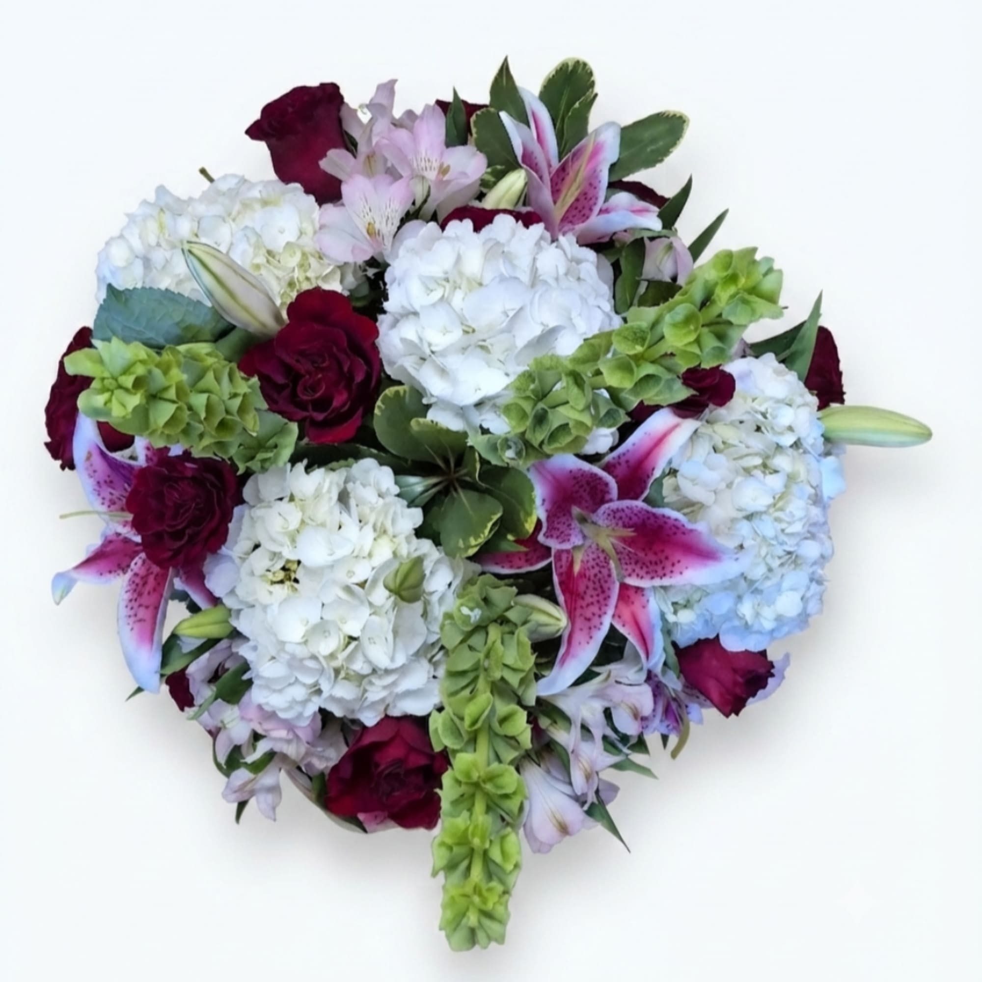 Round bouquet of white hydrangeas, pink lilies, and burgundy roses