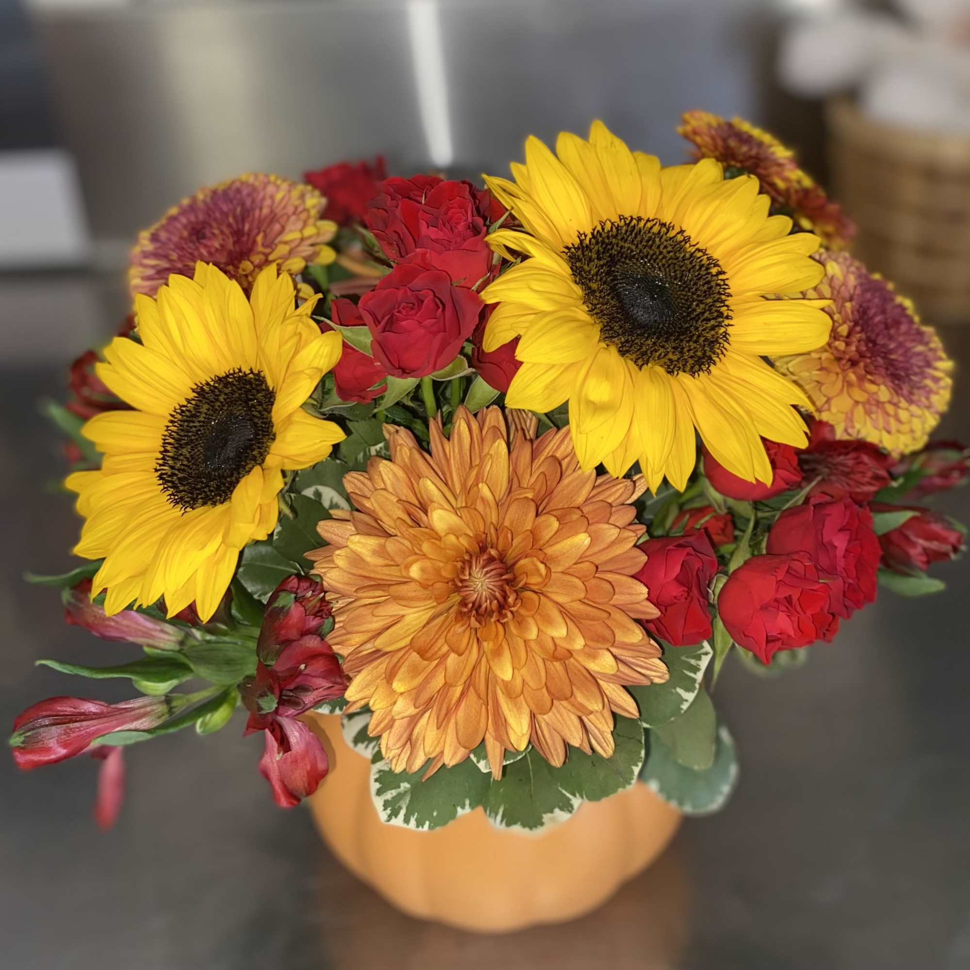 Combine the fall blooms with this wonderful pumpkin seasonal arrangement. Housed in, photo 2 of 2