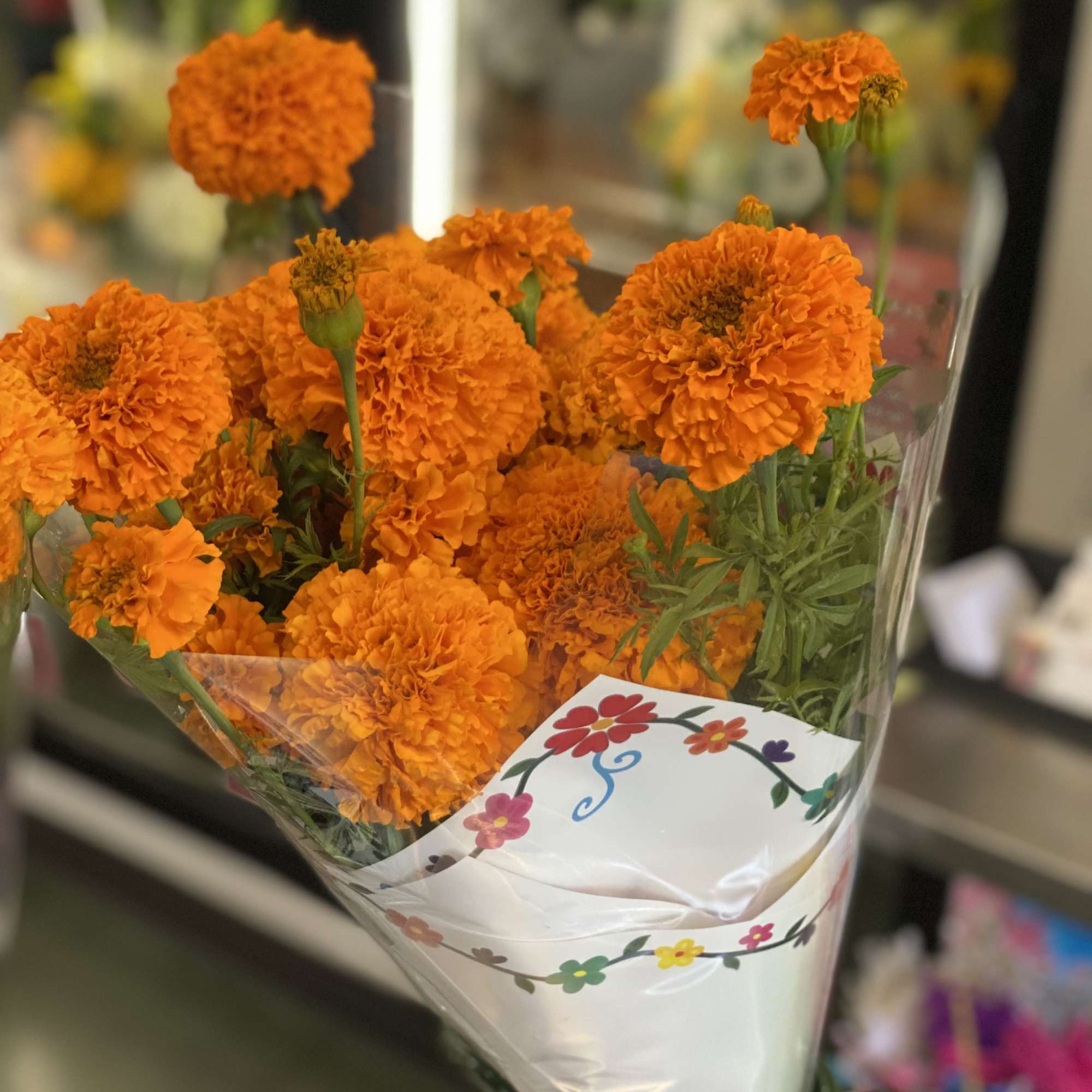 7-10 stems of orange marigolds., photo 2 of 3