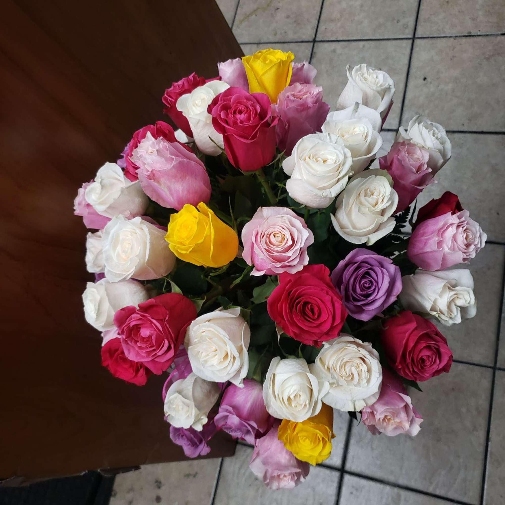 Bouquet of multicolored roses in pink, white, yellow, and purple, photo 3 of 4