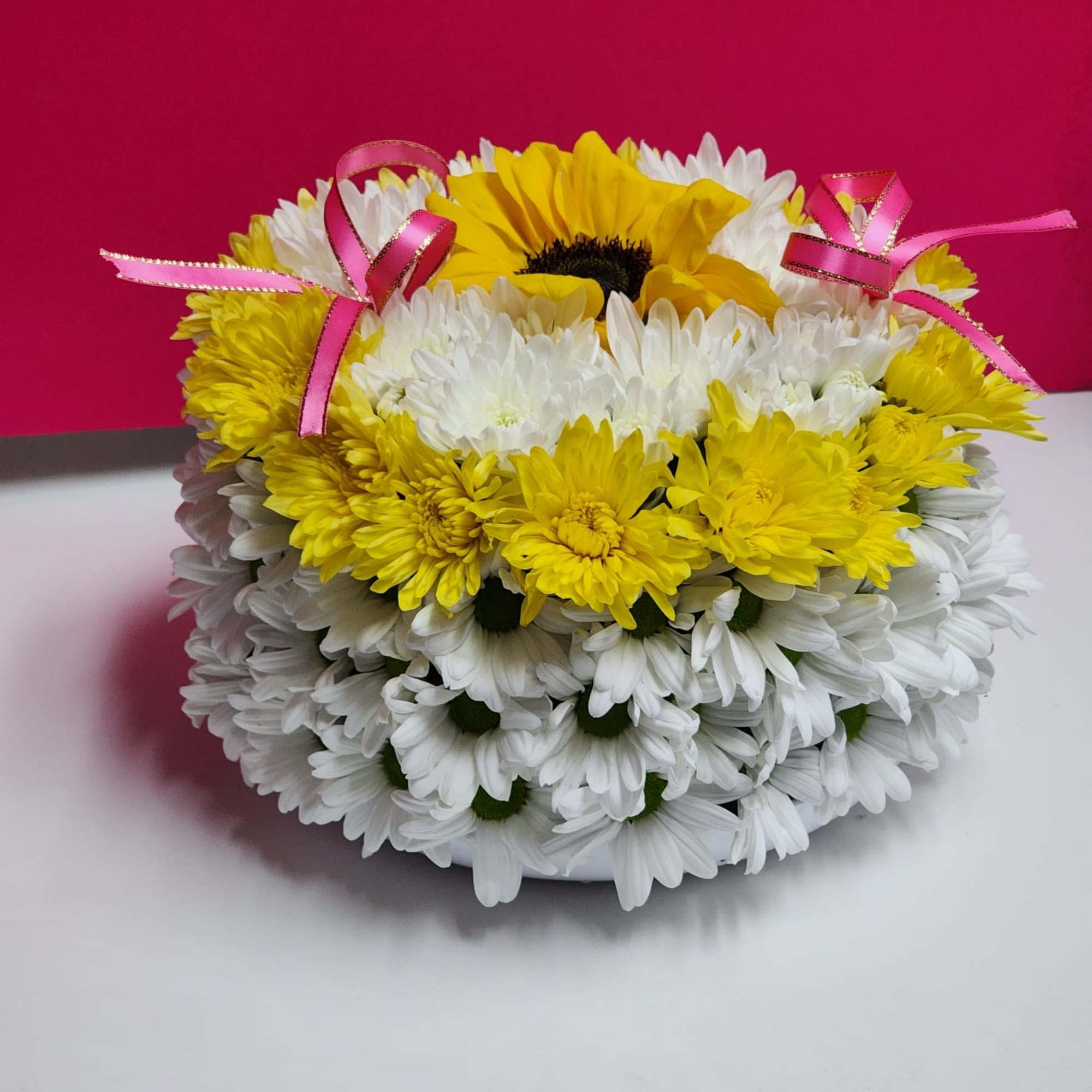 Round bouquet of white and yellow daisies with pink ribbon bows, photo 2 of 2