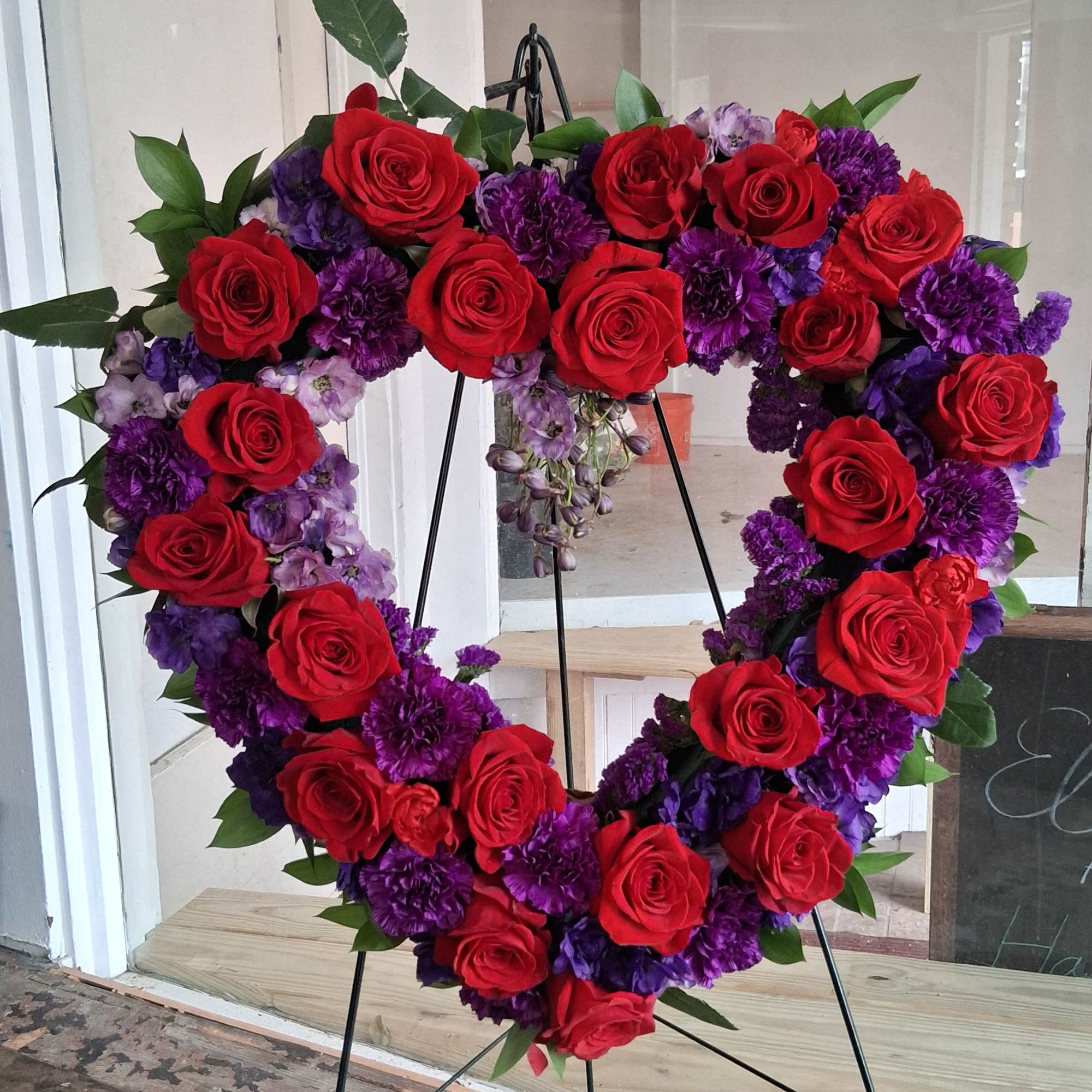 Purple Heart&rdquo; is a beautifully crafted heart‑shaped wreath featuring a dramatic blend
