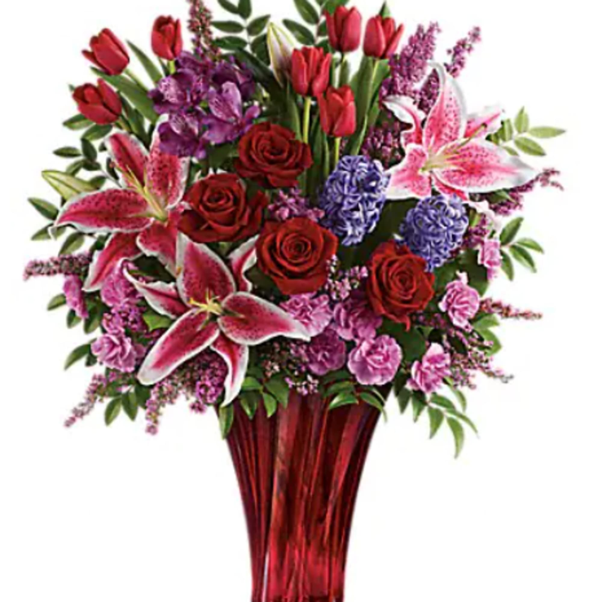 Bouquet of red roses, pink lilies, and purple flowers in a red vase