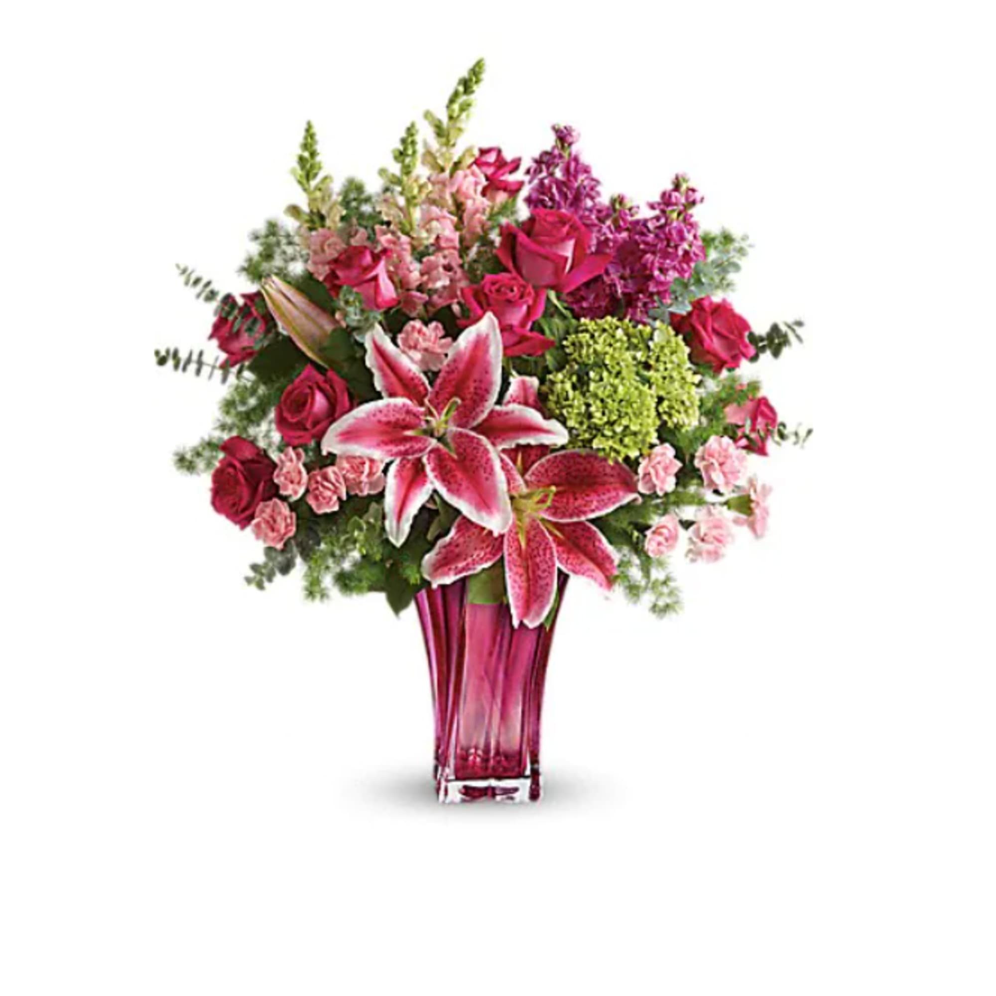 Pink and magenta bouquet with lilies and roses in a tall vase