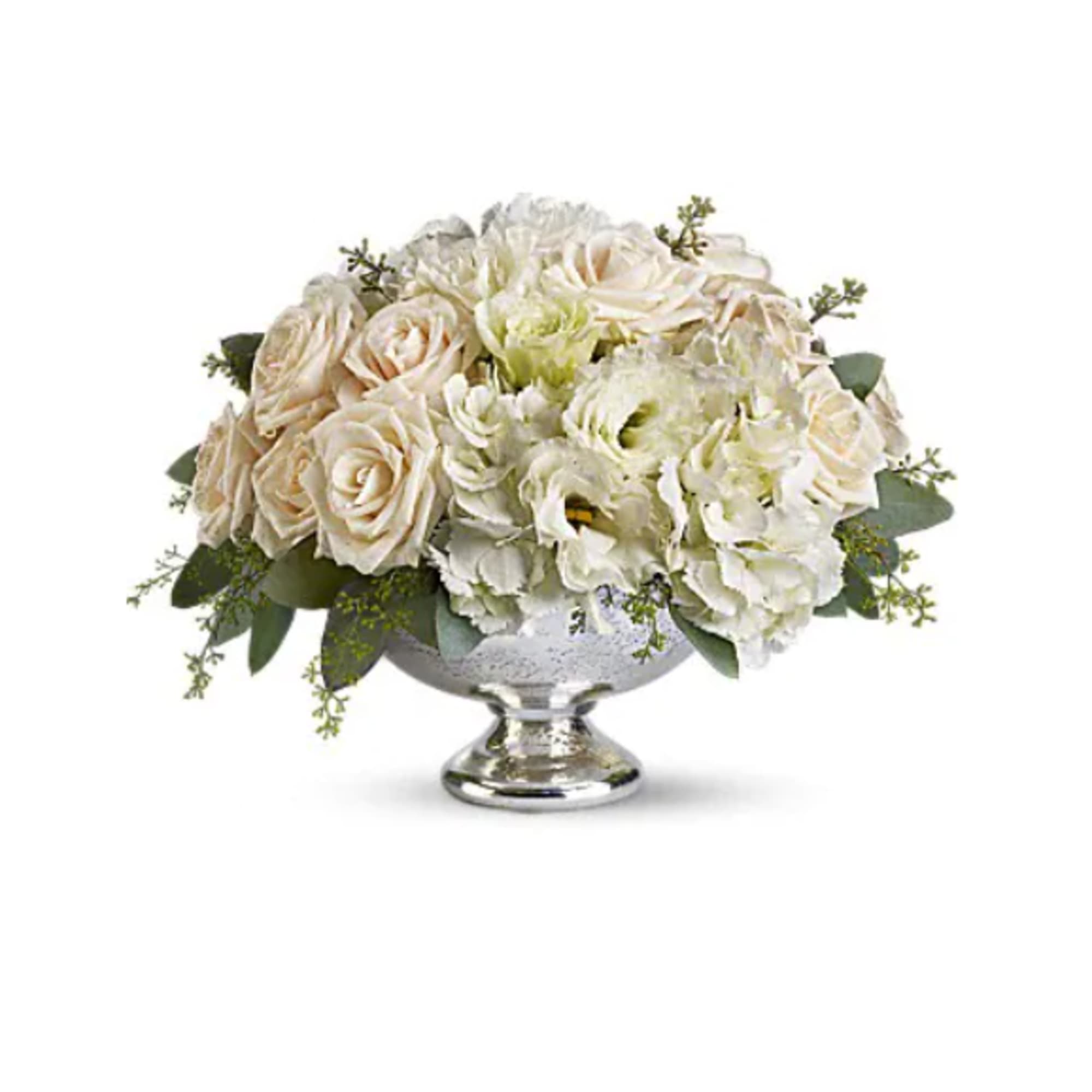 Cream and white roses arranged in a silver pedestal bowl