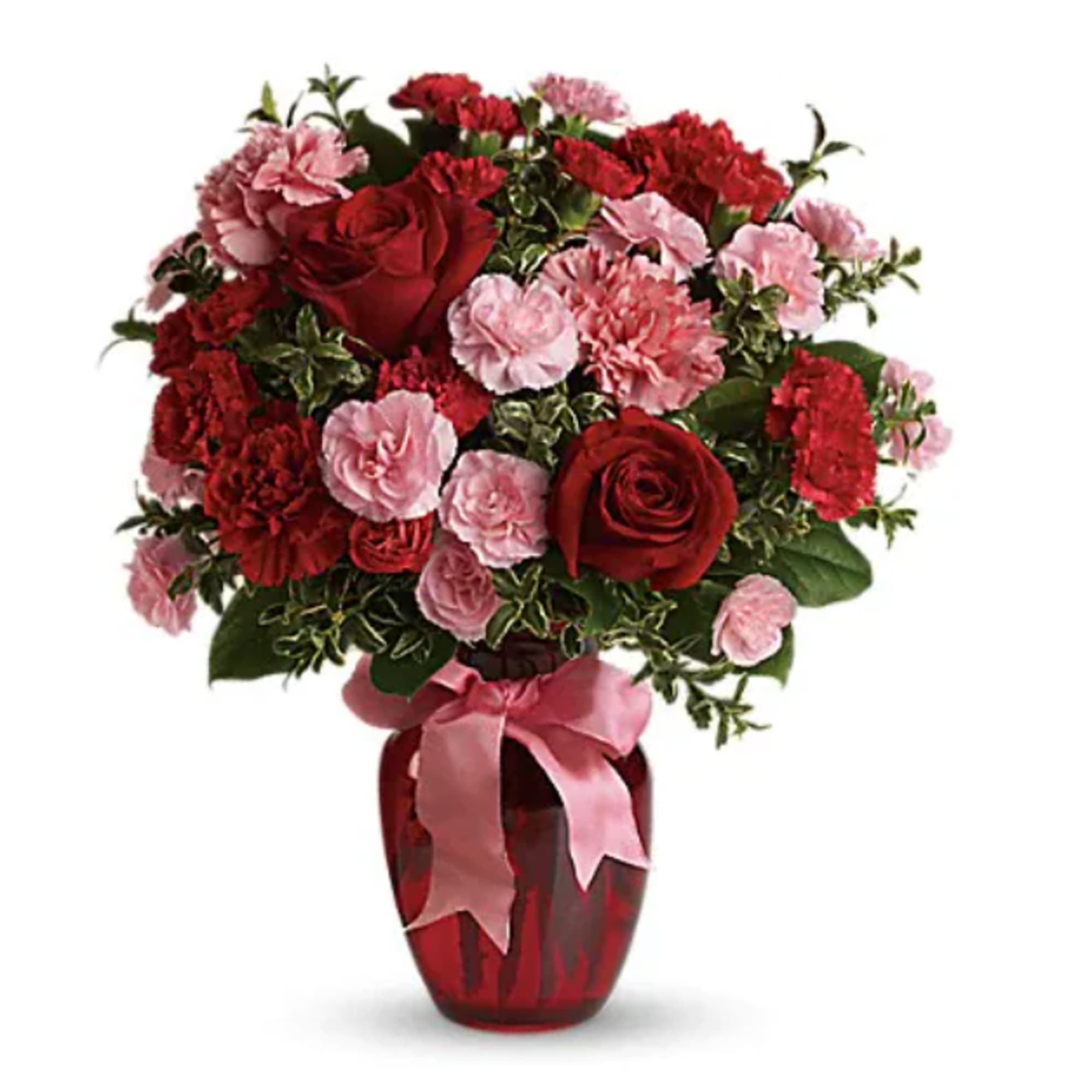 Red roses and pink carnations in a red vase with a pink ribbon