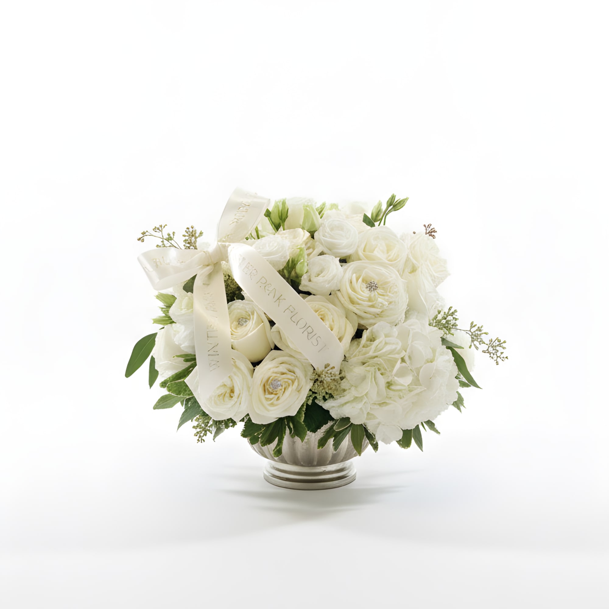White rose bouquet in a silver vase with cream ribbons