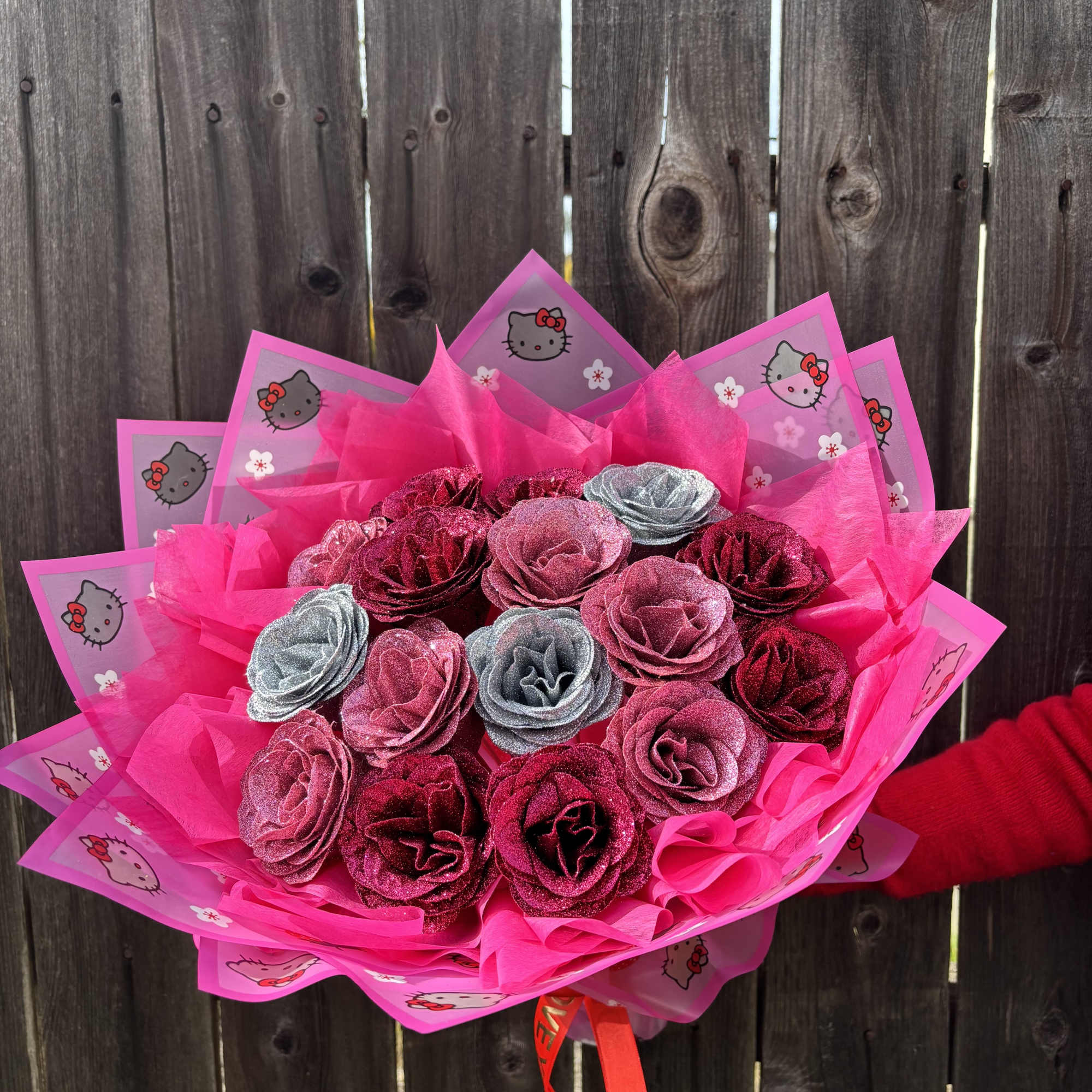 Pink glitter rose bouquet wrapped in Hello Kitty paper