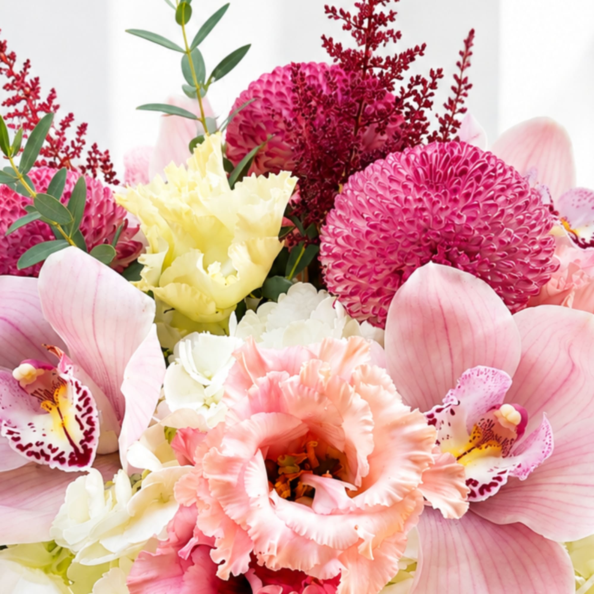 Pink and cream floral bouquet with orchids and carnations