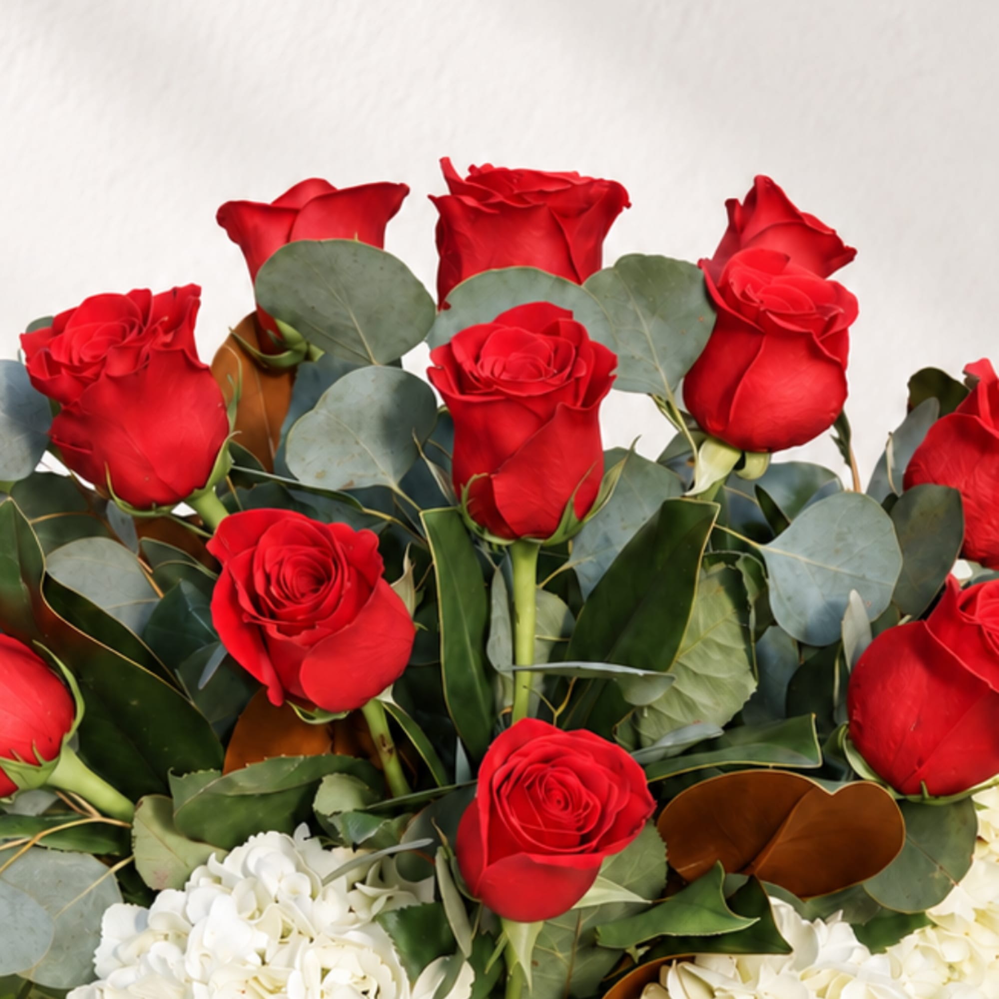 Bouquet of red roses with white hydrangeas and eucalyptus