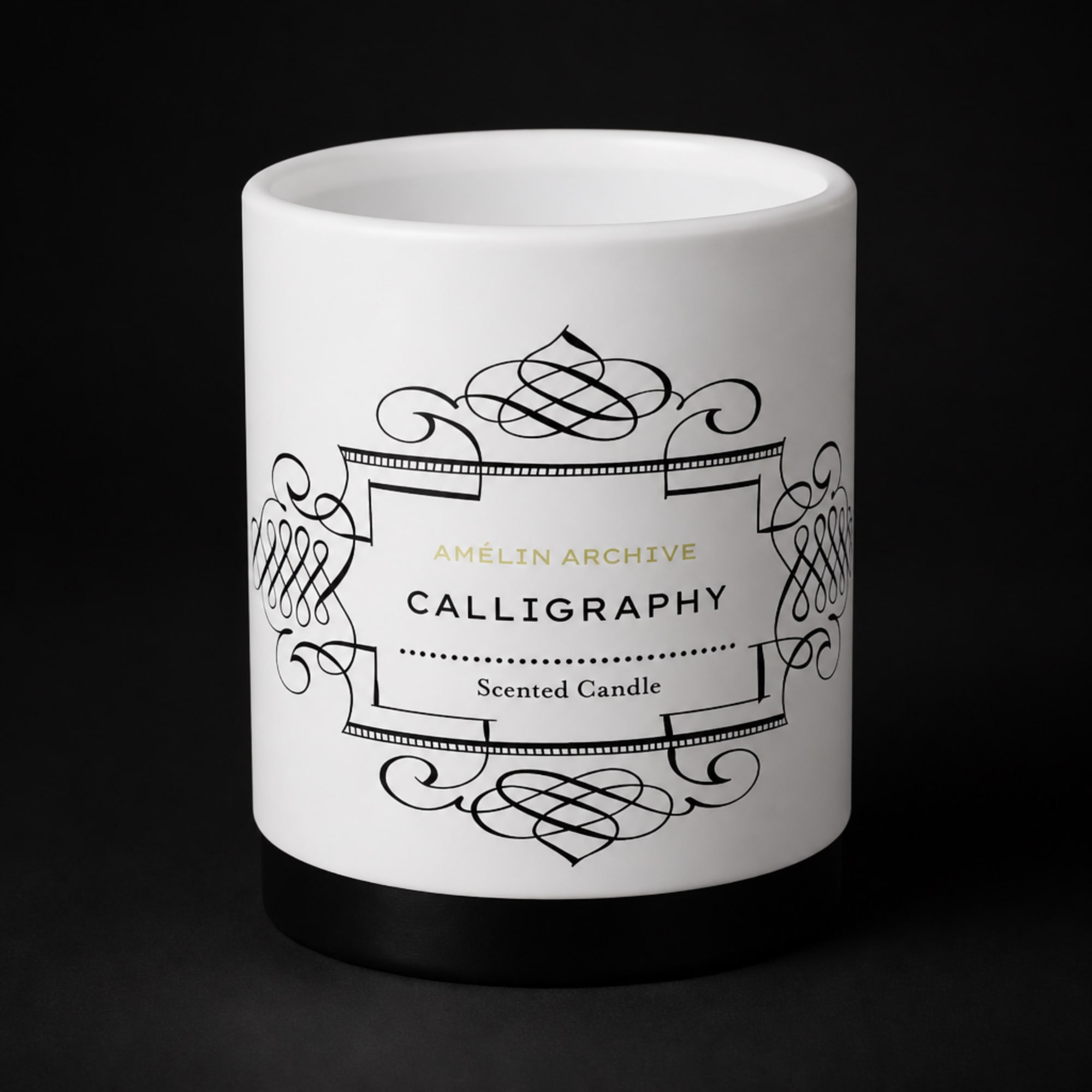 White scented candle in a black-and-white decorative jar