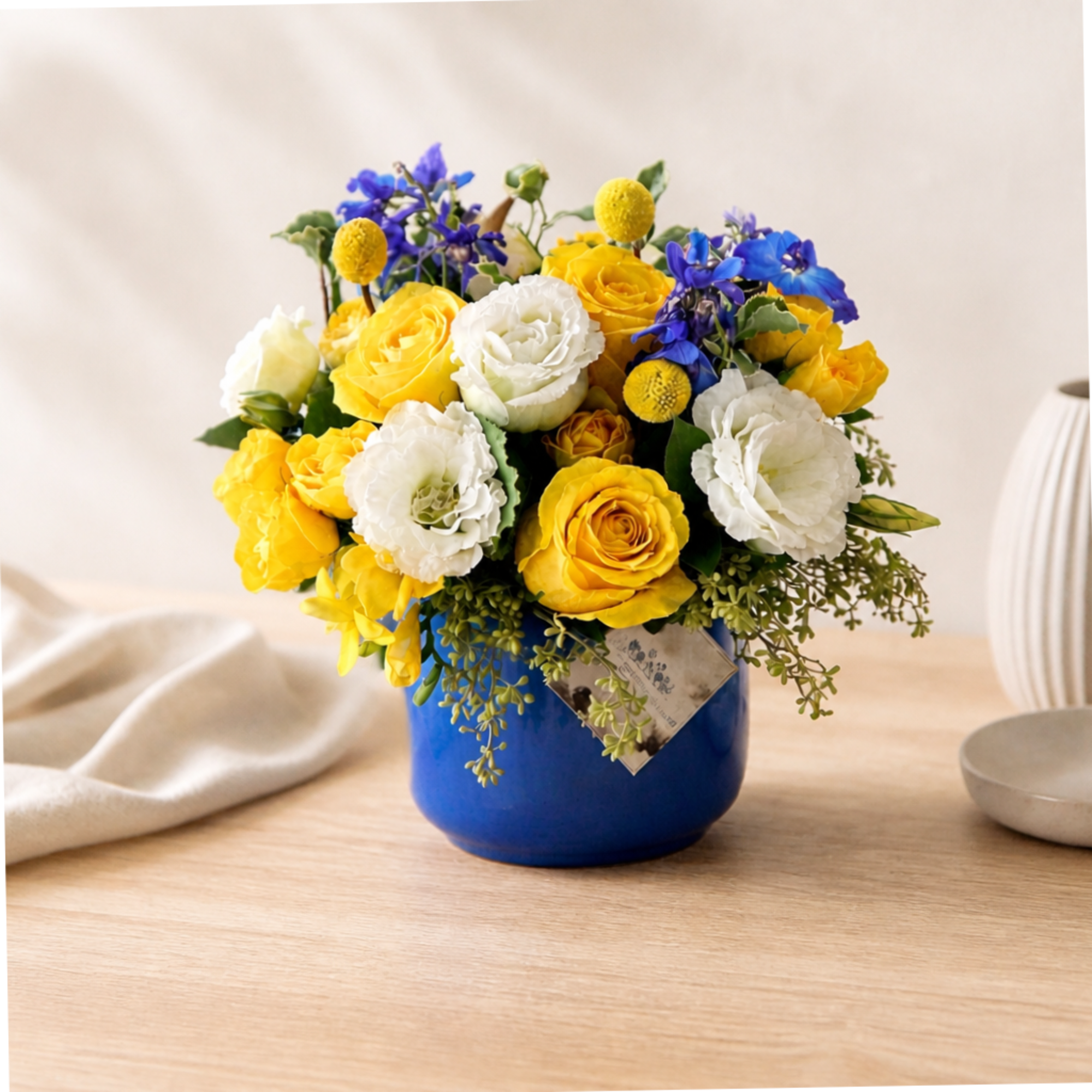 Yellow and white roses with blue flowers in a blue vase, photo 2 of 2