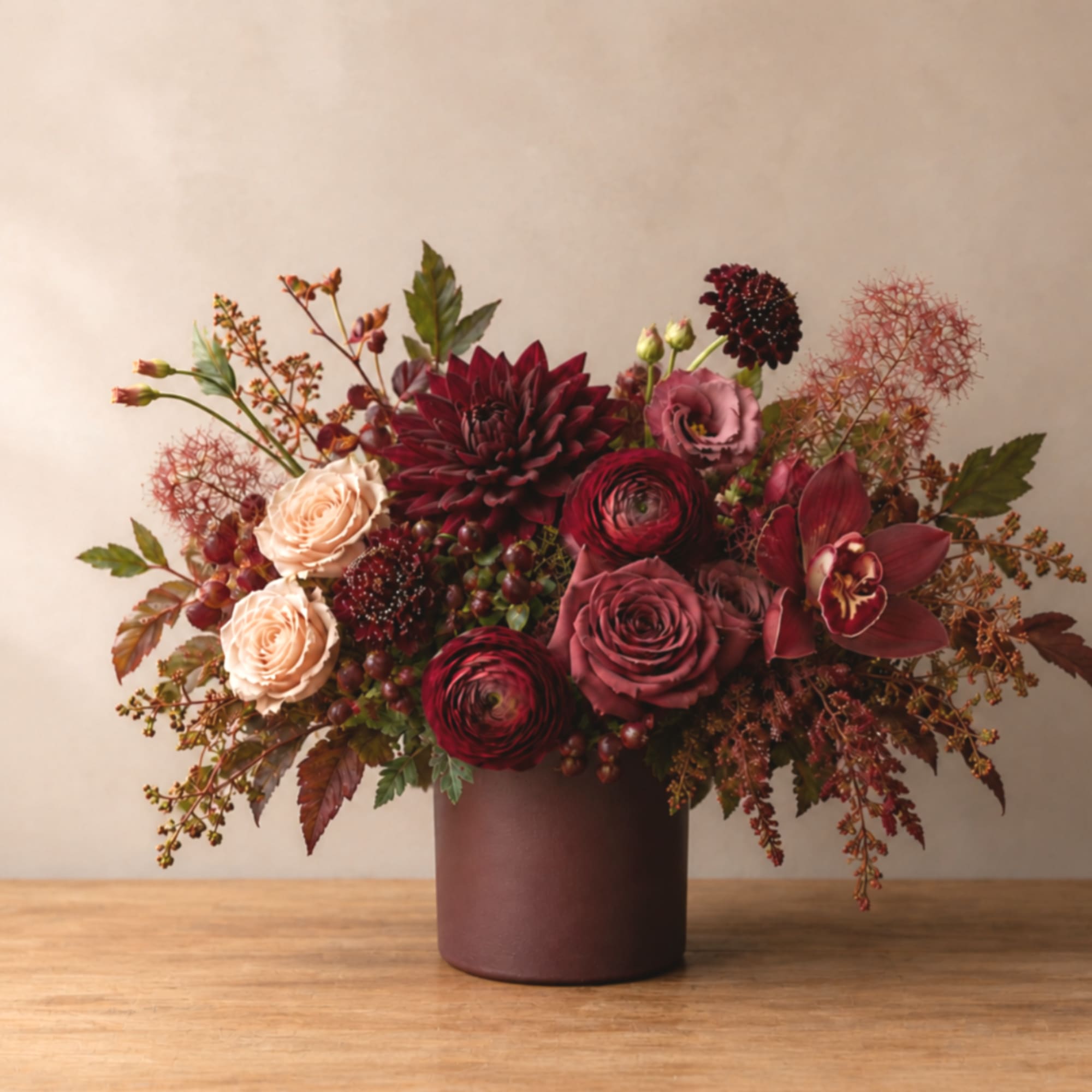 Deep burgundy and blush floral arrangement in a dark vase, photo 3 of 3