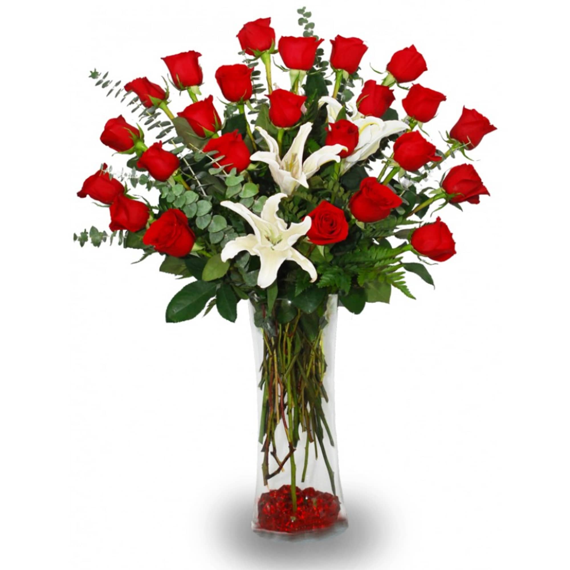 Tall bouquet of red roses and white lilies in a clear glass vase