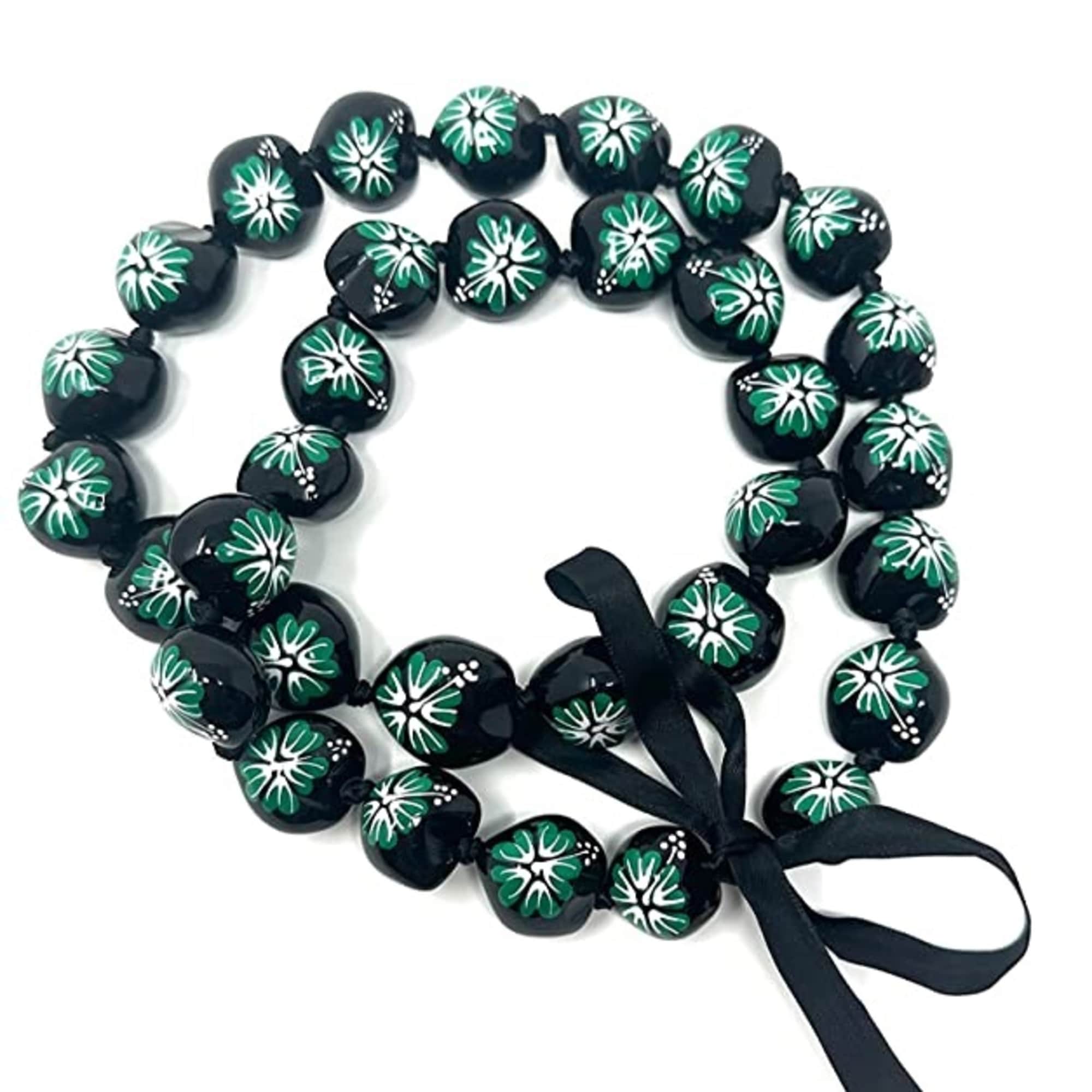 Black beaded necklace with green and white floral patterns and a black ribbon bow