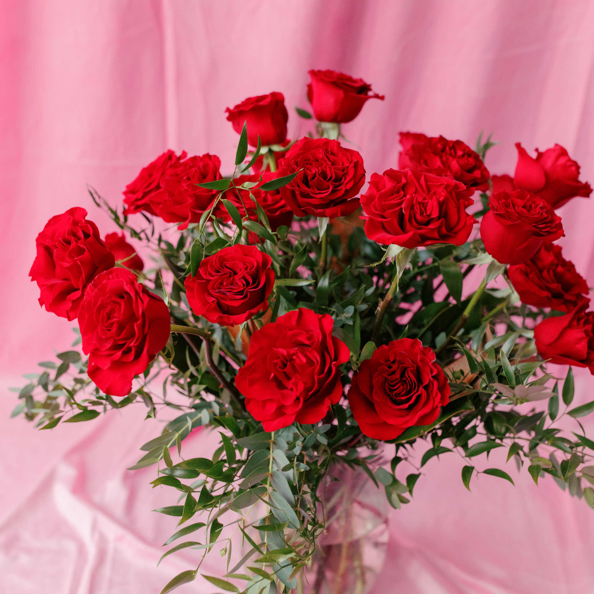 Bouquet of red roses in a clear glass vase
