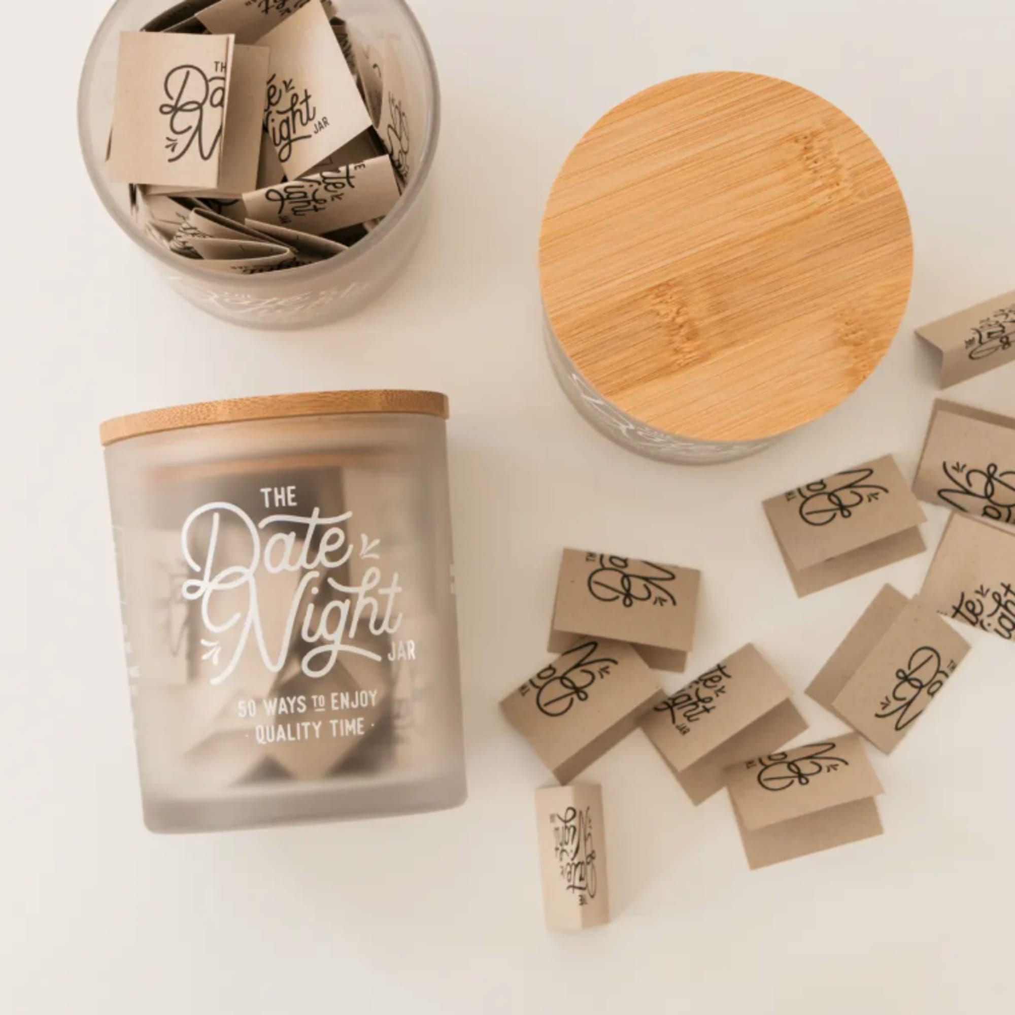 Frosted jar candle with a bamboo lid and small paper matchboxes