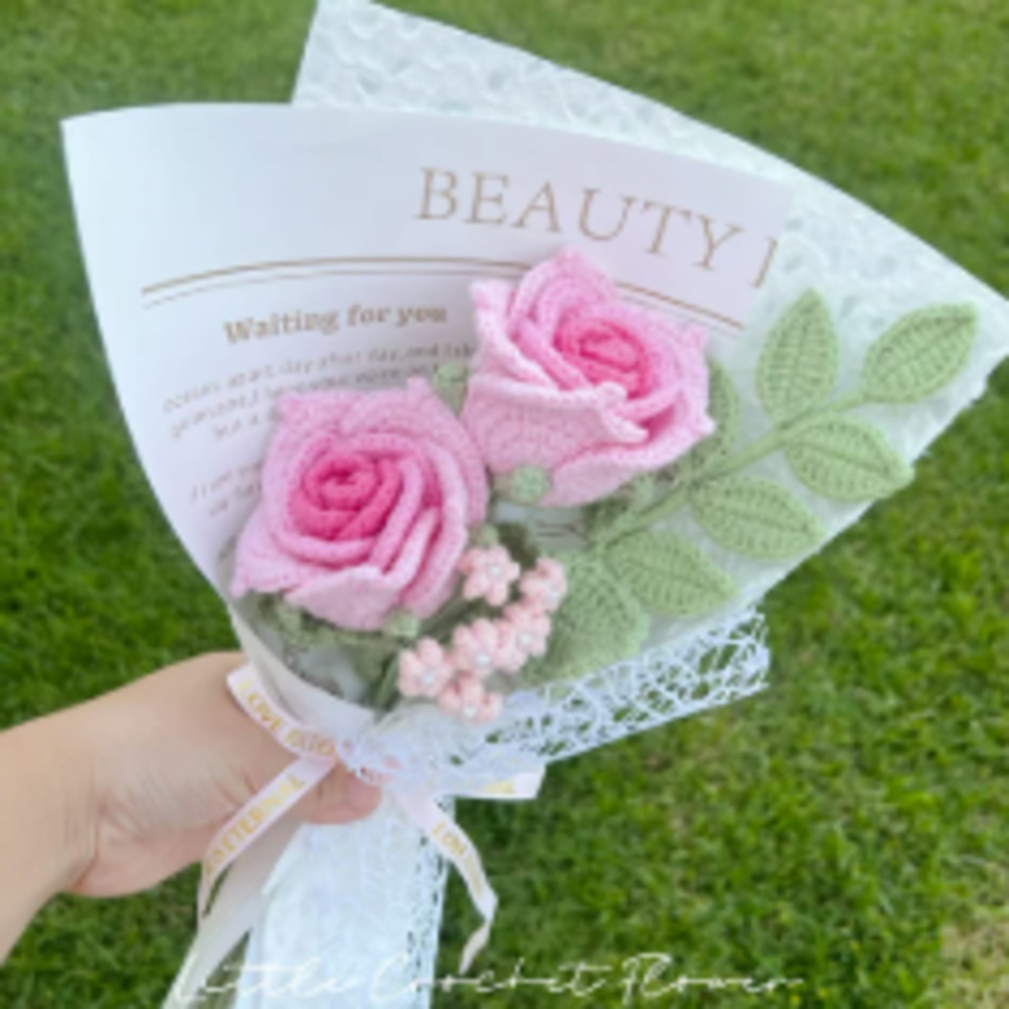 Small pink rose bouquet wrapped in white paper