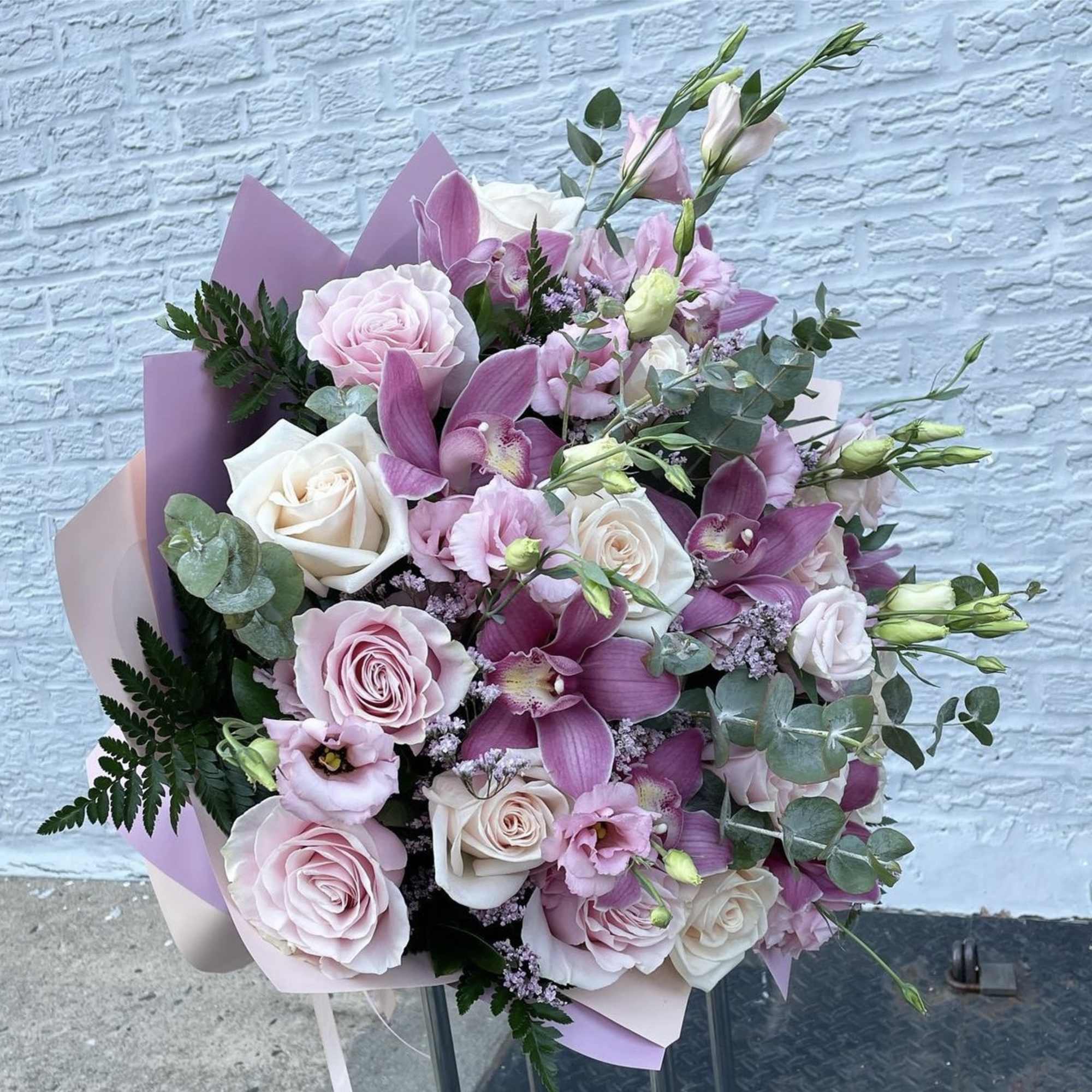 Bouquet of pink and white roses with purple orchids, photo 2 of 2