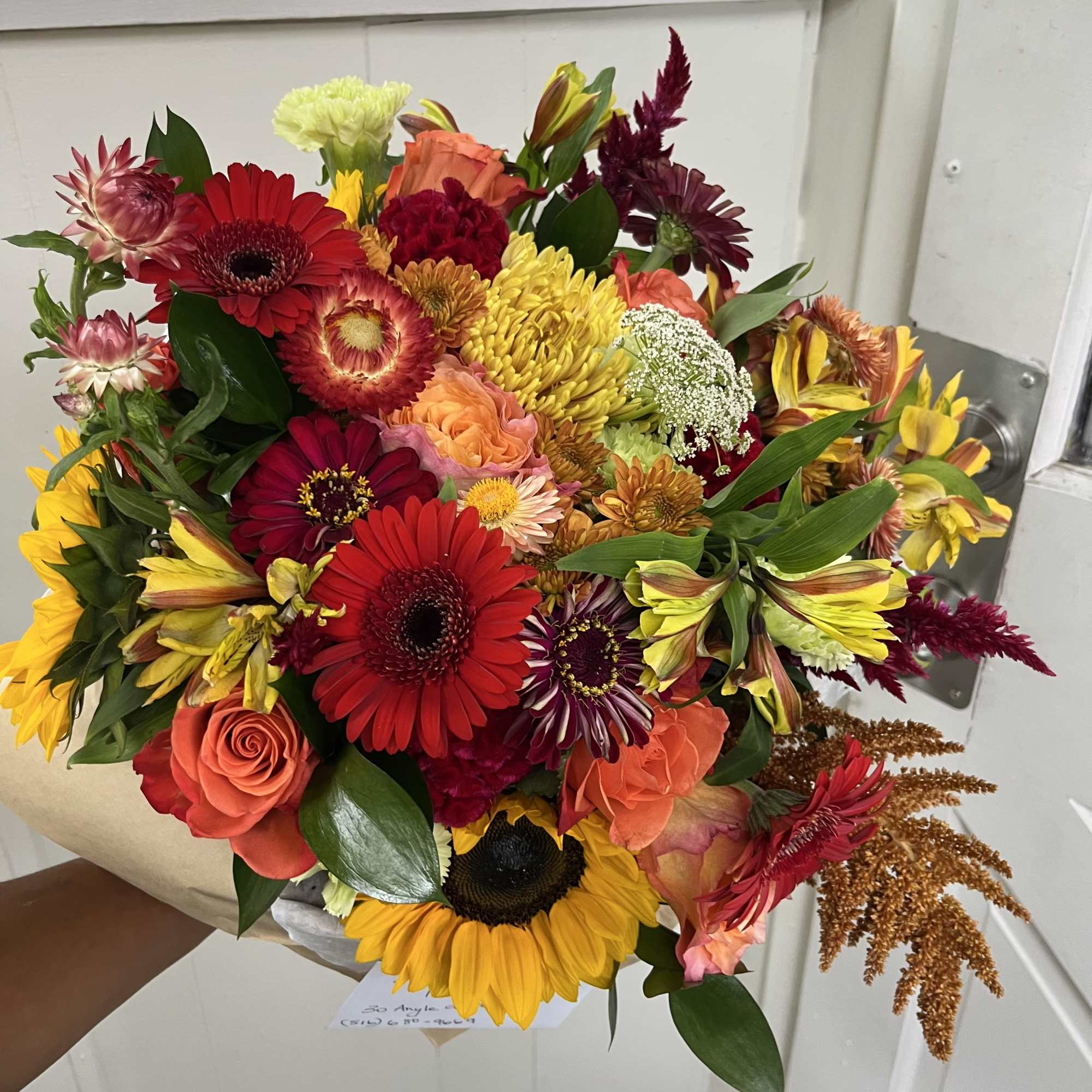 This arrangement is a wrapped bouquet with a mix of beautiful fall, photo 2 of 2