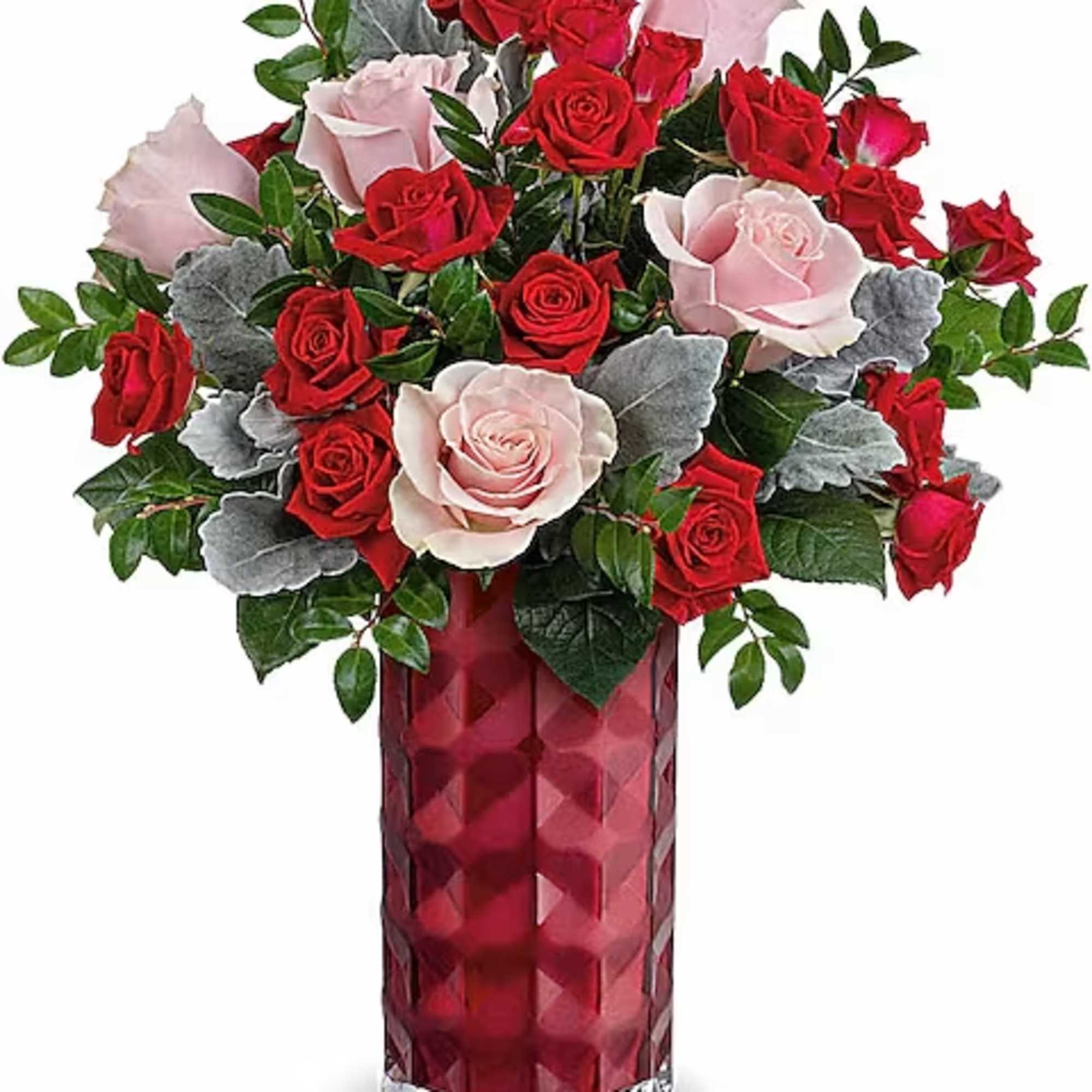 Red and pink roses arranged in a tall red vase