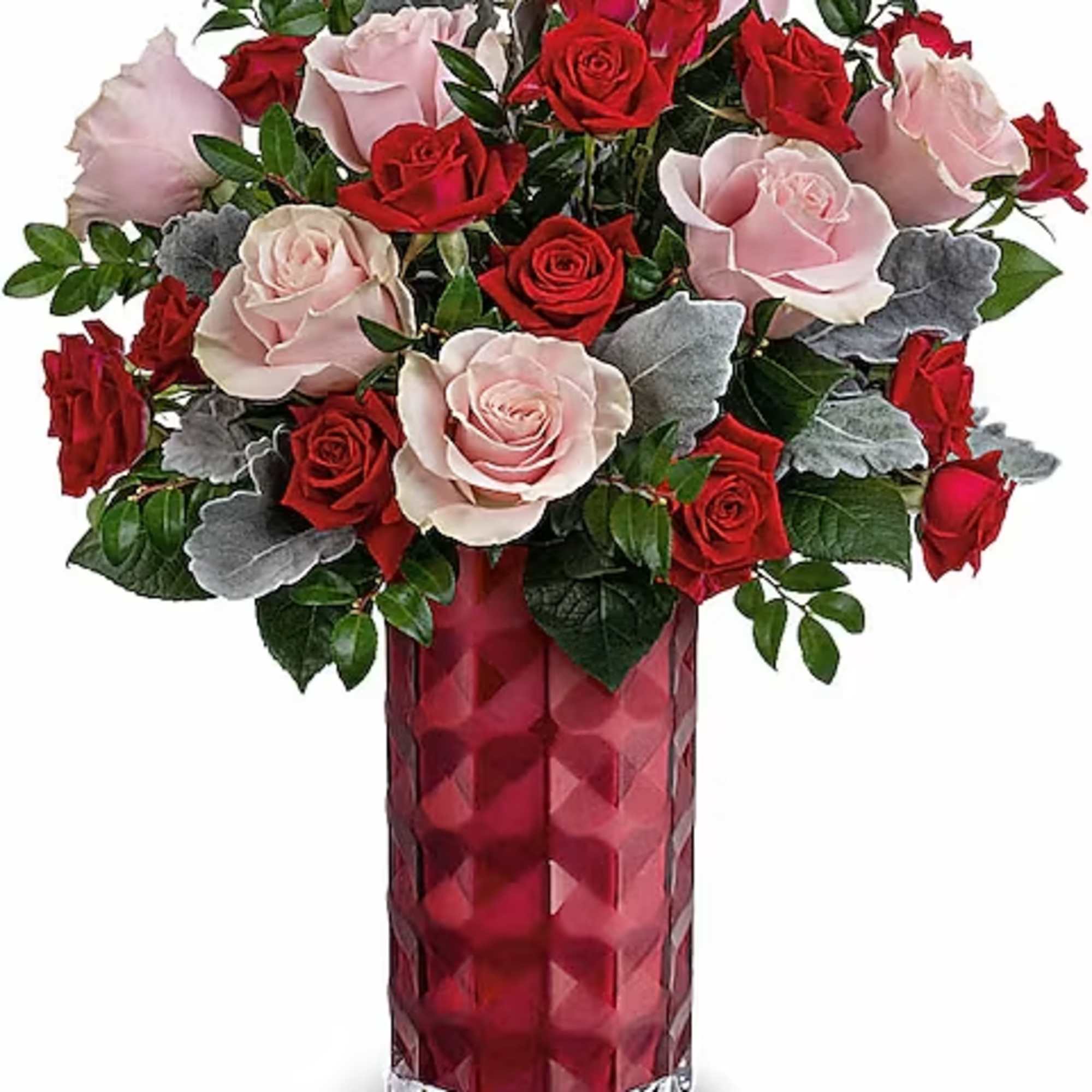 Red and pale pink roses in a red glass vase