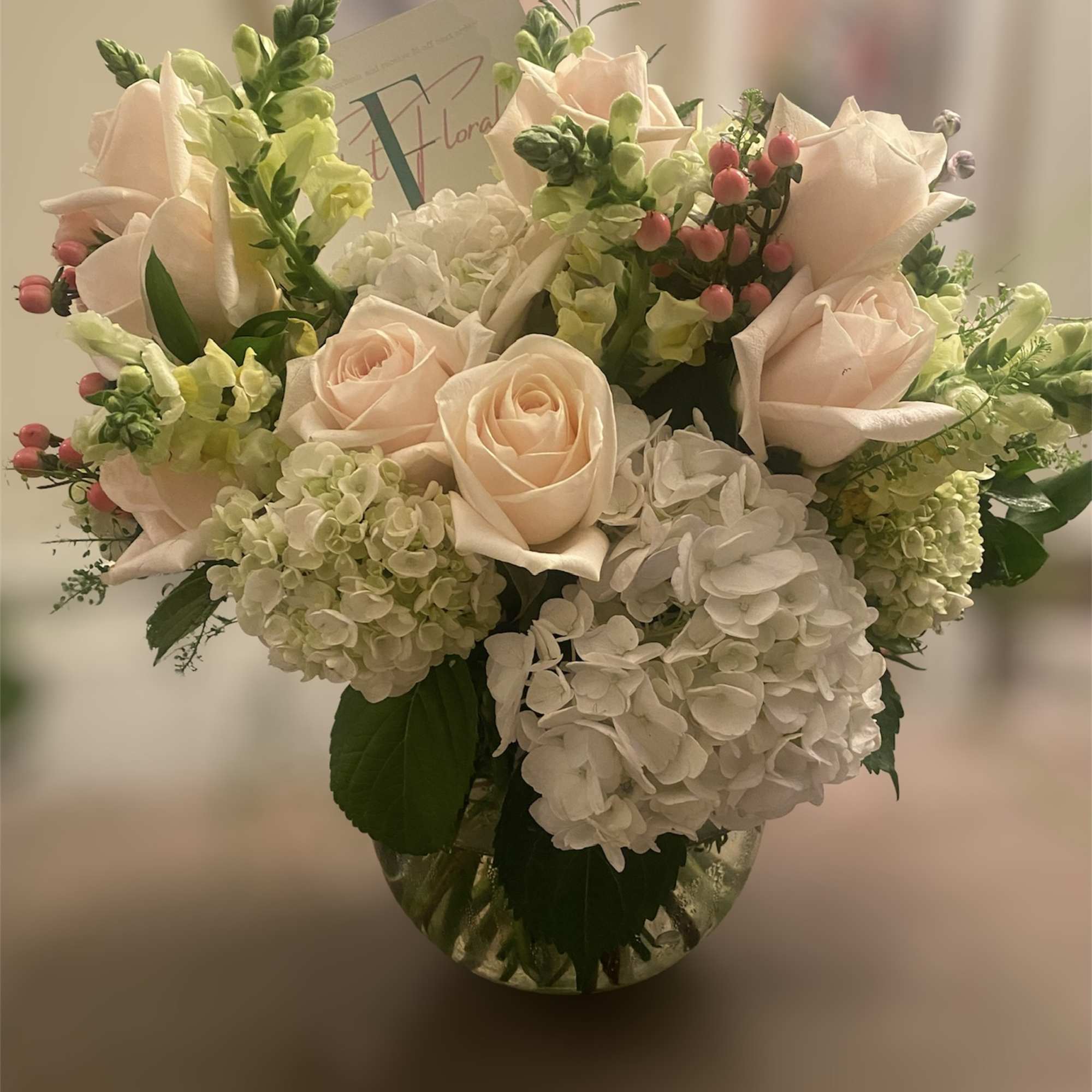 A luscious combination of hydrangeas &amp; roses adorned with seasonal  blush